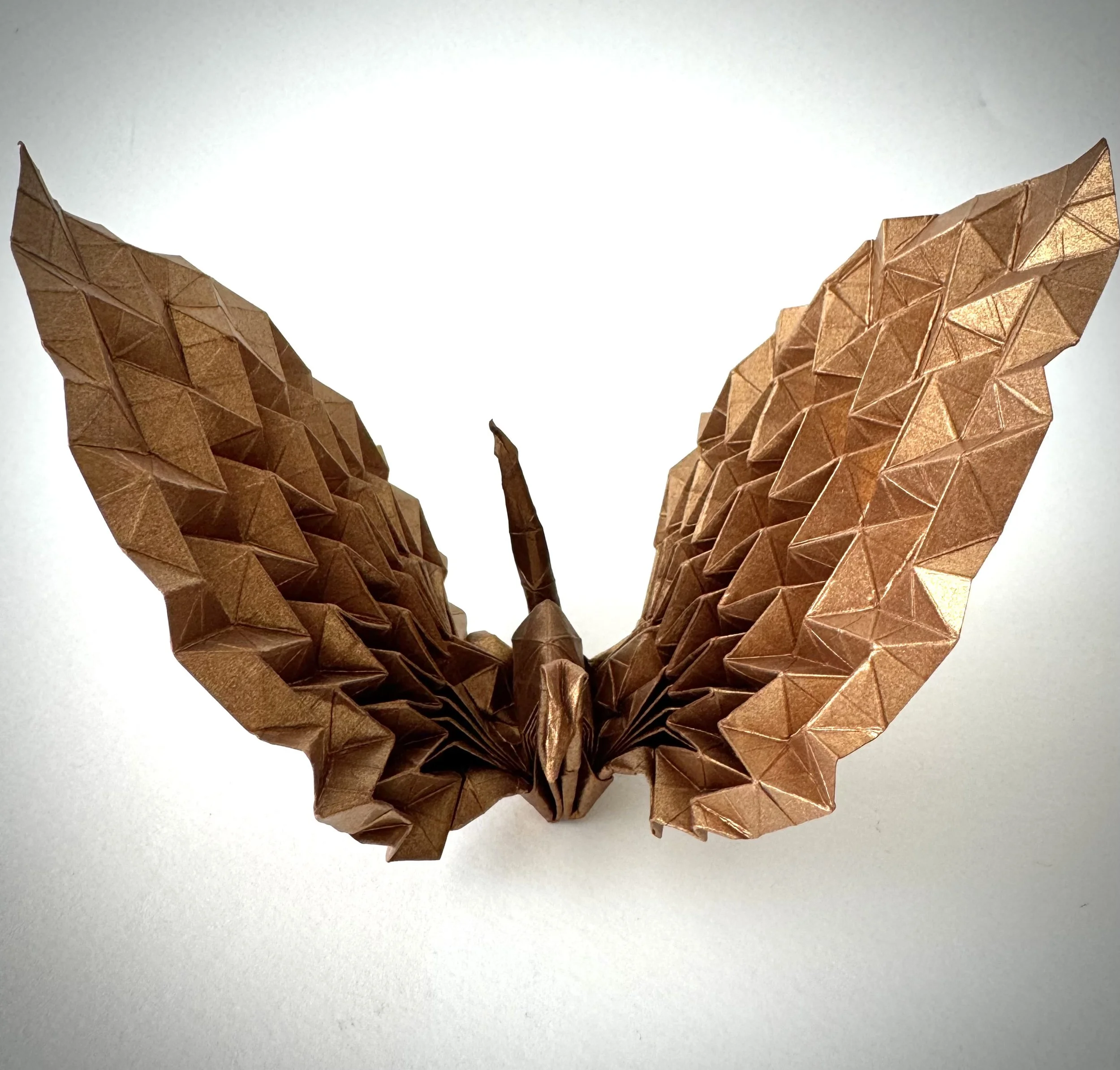 The crane — a symbol of Japan. Every Japanese elementary school student can fold one. But I got bored, so I redesigned the wings in Miura-ori. You’re welcome.