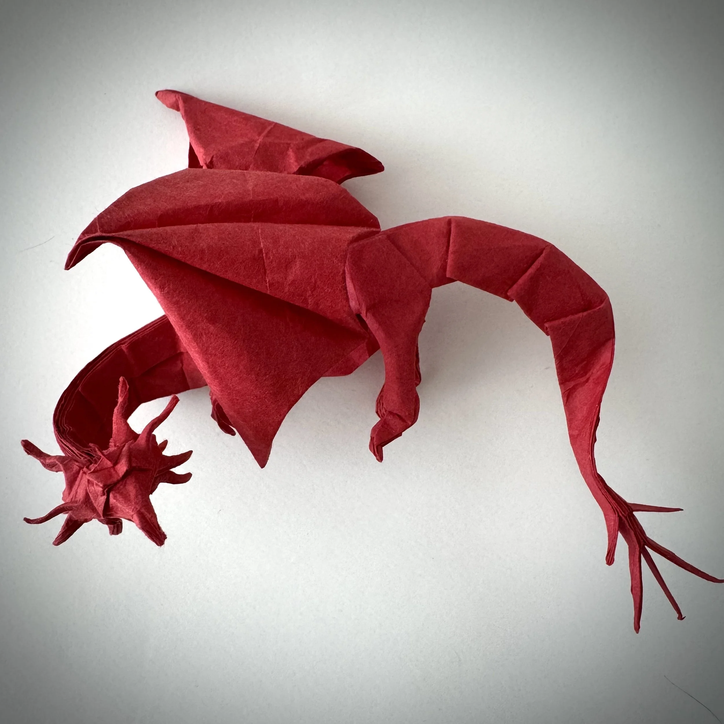 Folded from Japanese Washi paper. Its dense fibers allowed me to push each fold to the limit — no fear of tearing.