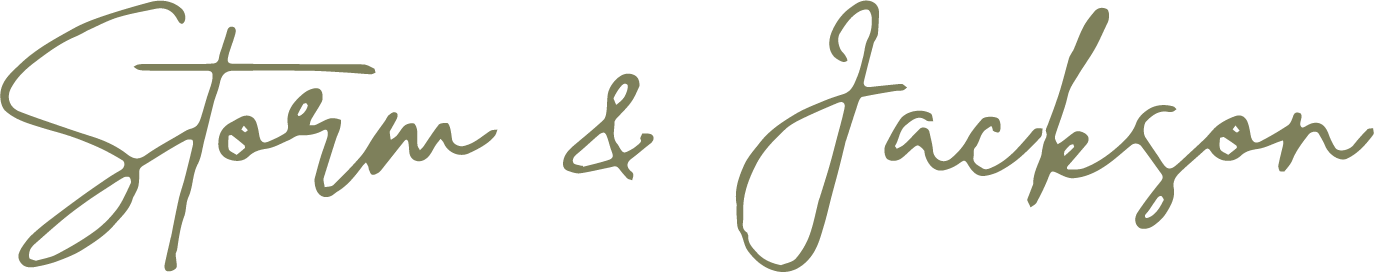 Stylized text of the names 'Storm & Jackson' written in cursive with a black background.