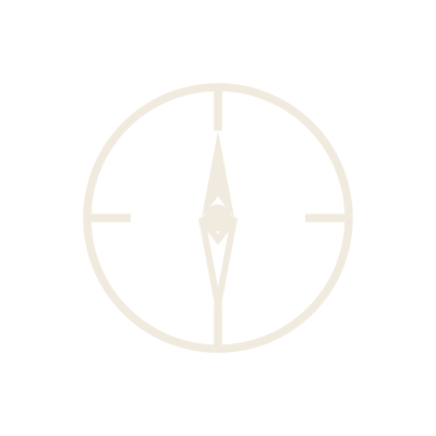 A simple black and white compass face with the needle pointing north.