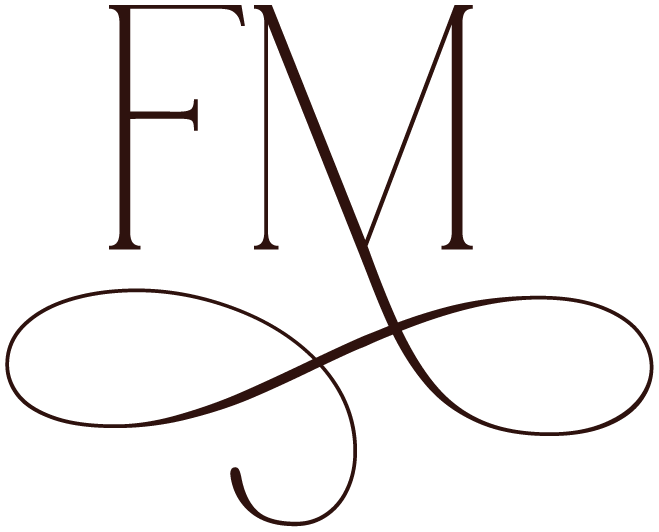 Stylized logo with the letters 'FM' and a decorative loop at the bottom.