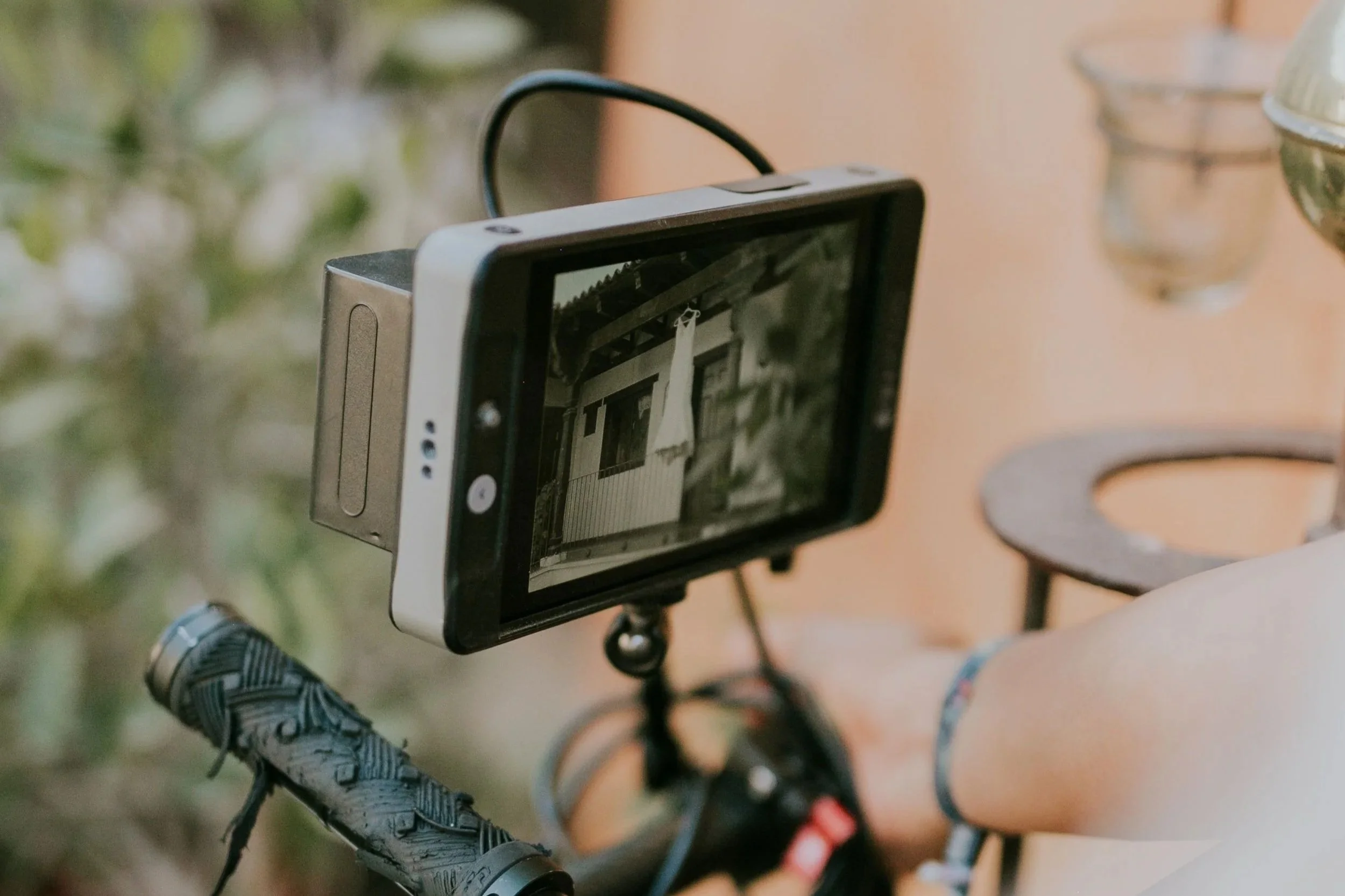 Camera monitor and filming equipment on a production set.