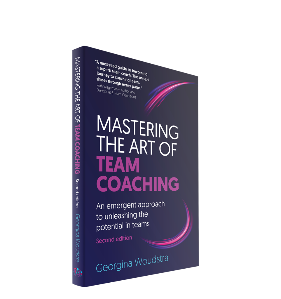 Book titled 'Mastering the Art of Team Coaching' by Georgina Woudstra, second edition, with a dark purple cover featuring pink and purple curved lines and a quote at the top.