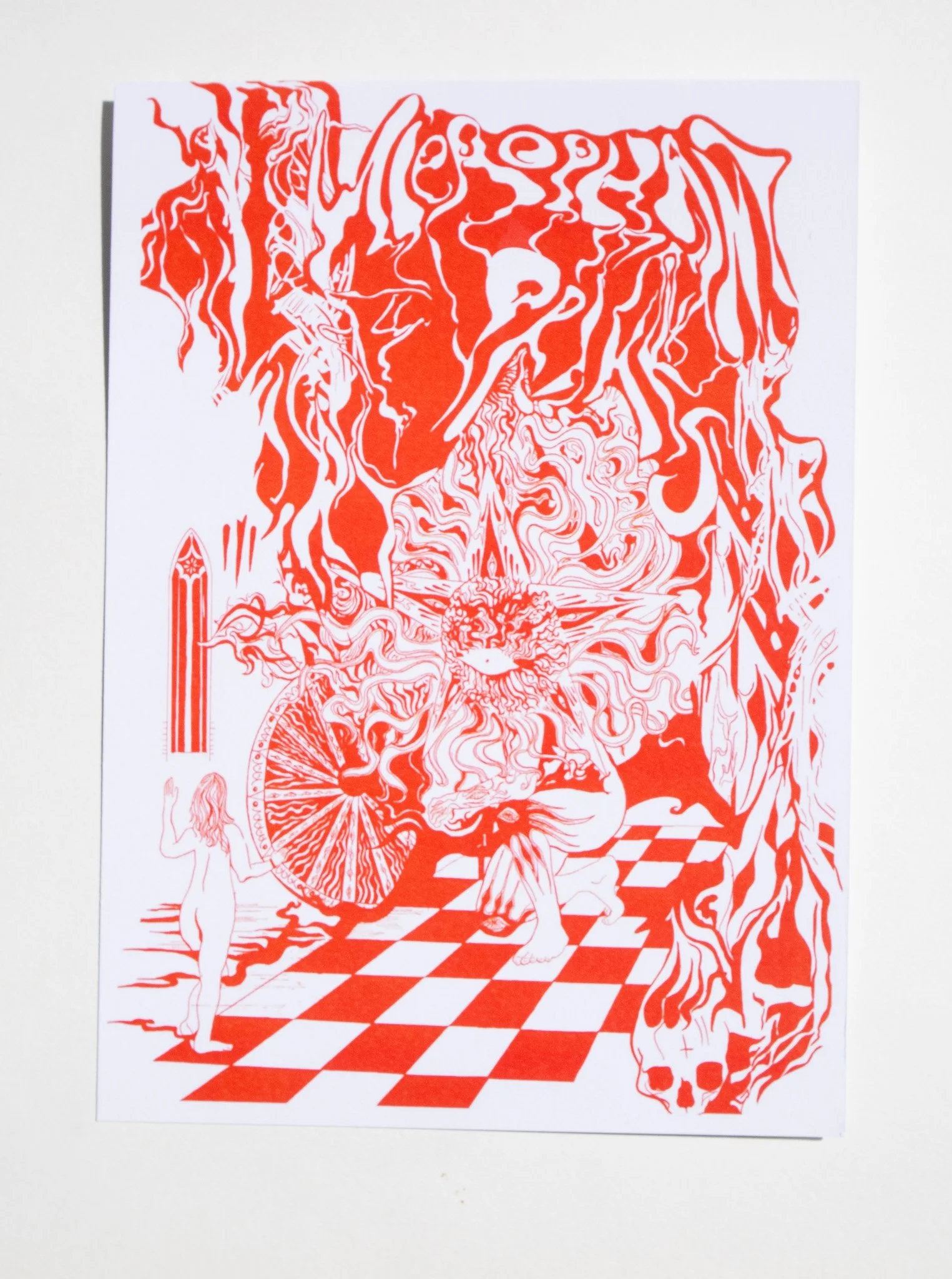 photo of a print featuring a red and white psychedelic poster featuring a giant with the face of the sun surrounded by swirling shapes and patterns.
