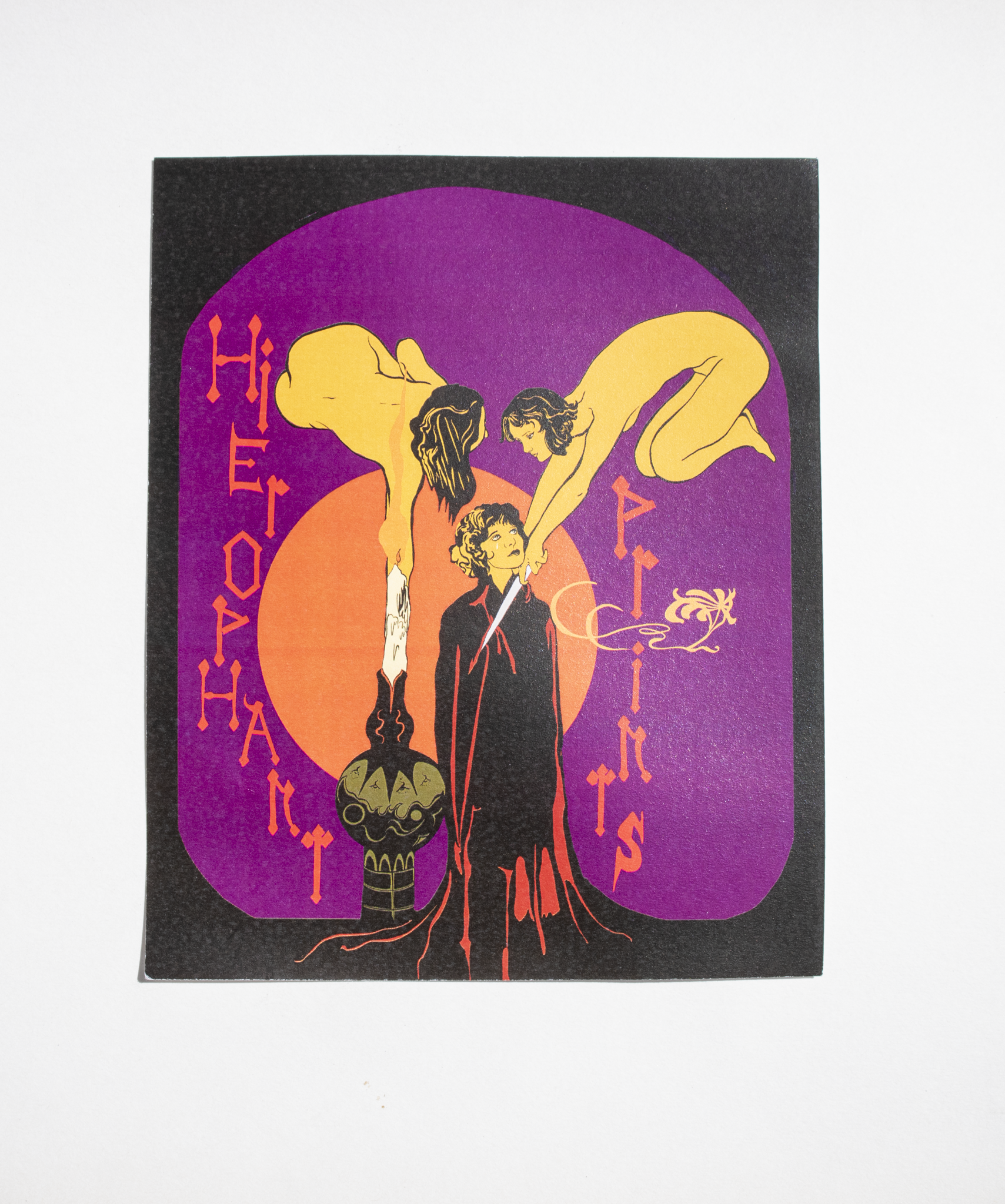 photo of a print of a colourful Art Nouveau image of a cloaked woman surrounded by nude women with daggers, including psychedelic text reading Hierophant Print