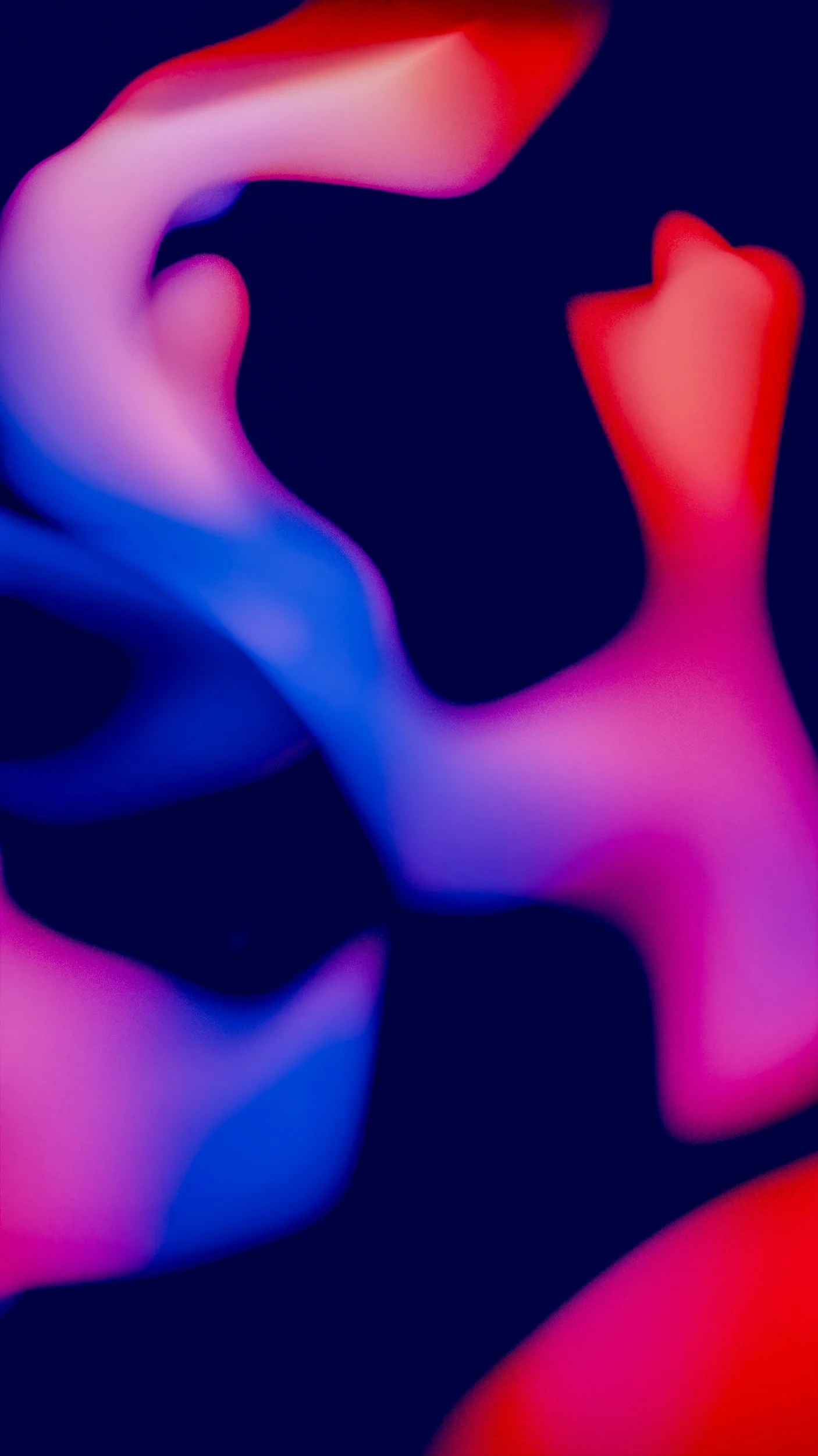 Abstract image with flowing, colorful shapes in shades of pink, blue, purple, and red on a dark background.