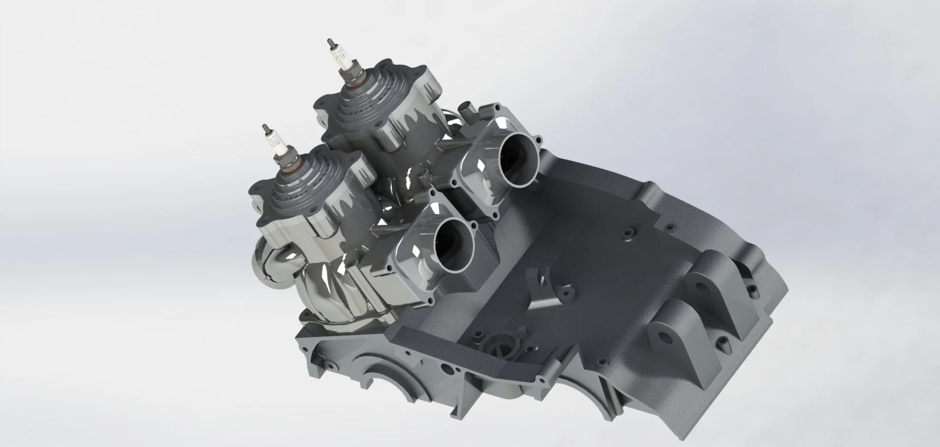 A 3D model of a car engine block with two cylinder heads attached, set against a light background.