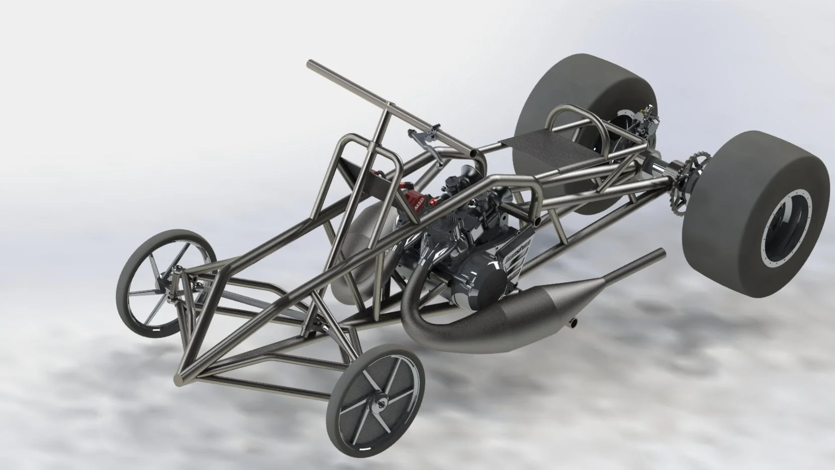 A metal-framed racing car chassis with large rear tires, smaller front tires, and an engine mounted in the middle.