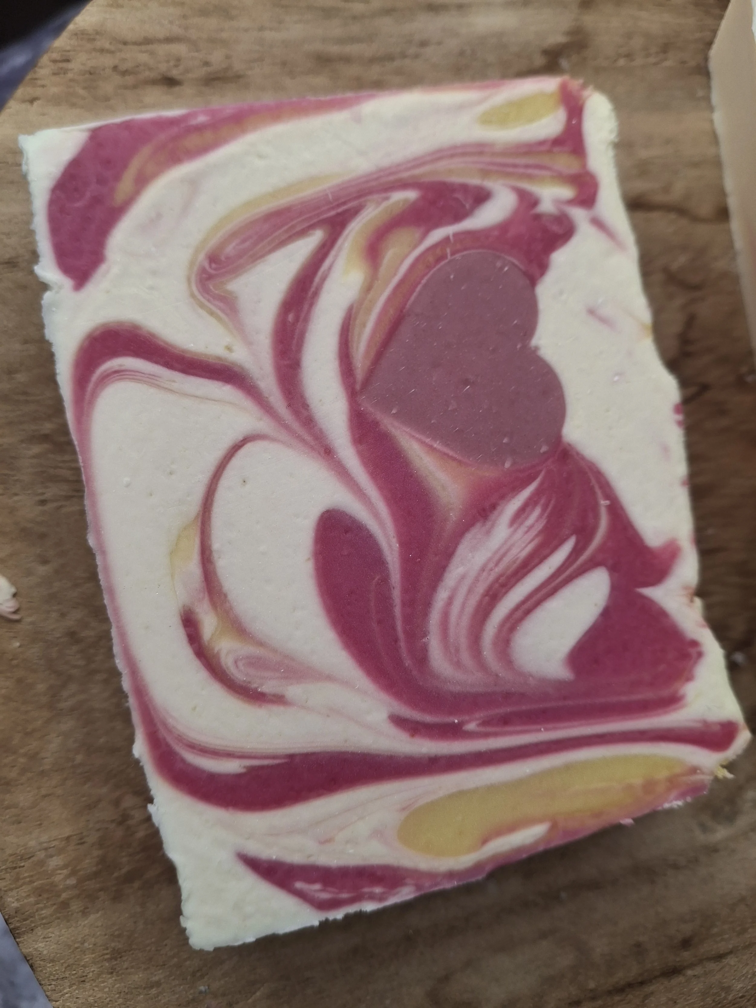 Love artisan tallow soap with striking raspberry-pink swirls, creamy ivory layers and a heart embed. A feminine floral blend of Rose Quartz, Pink Peony and Musk. Made with Oats Clay & Tussah Silk