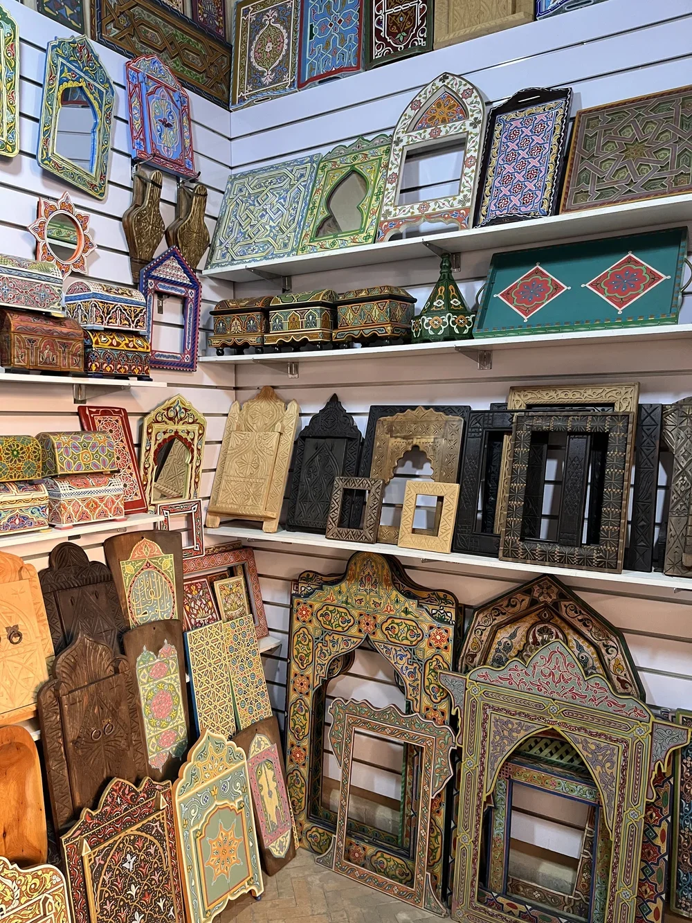 Intricately carved and painted frames in a Moroccan souk.