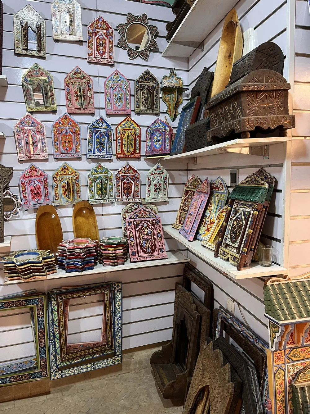 Intricately hand-painted mirrors and frames in a Moroccan souk.