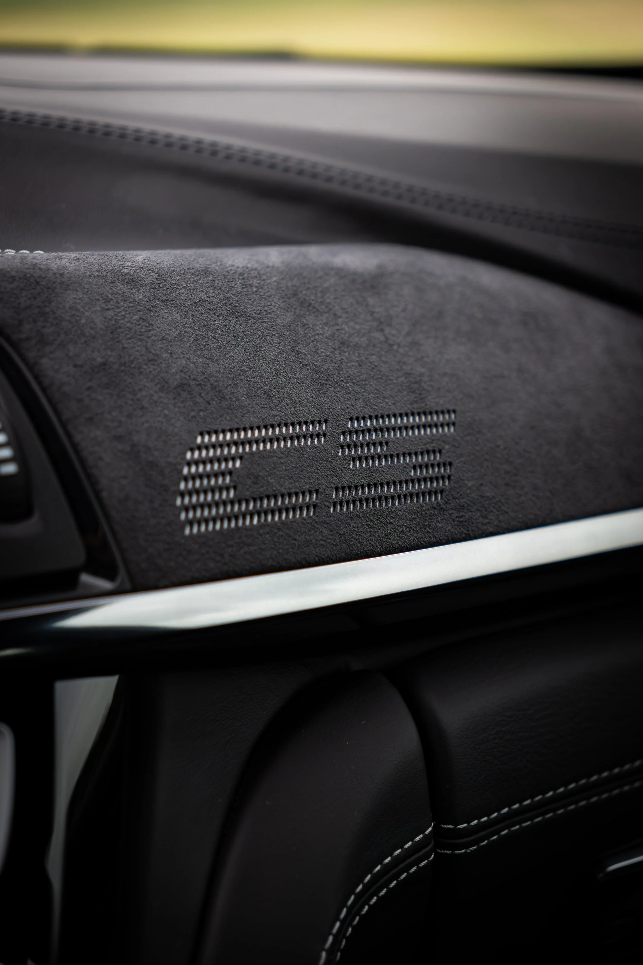 Close up of the CS accent on the alcantara dashboard of a 2019 BMW M4 CS