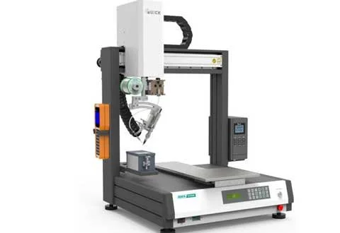 Industrial laser cutting machine with a control panel and robotic arm.