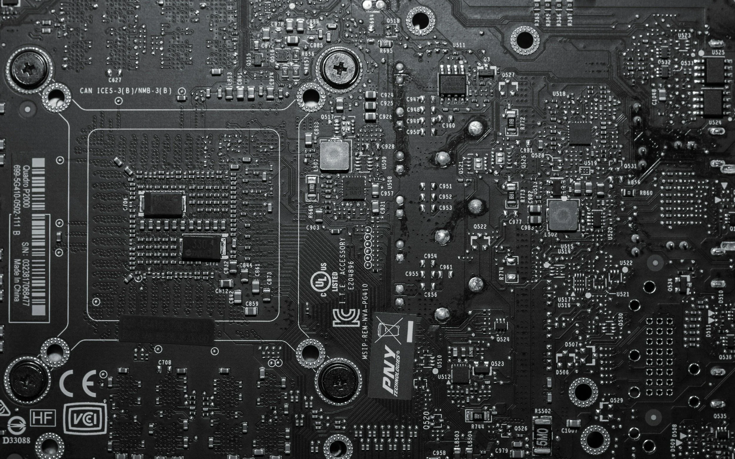 Close-up of a printed circuit board with numerous electronic components and traces.