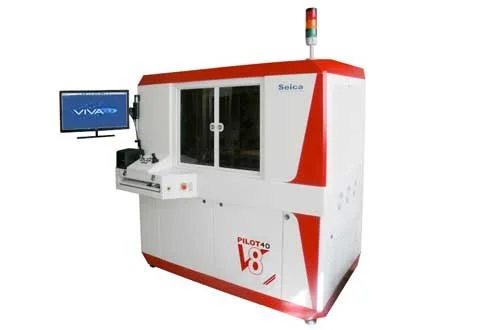 A large industrial machine with a red and white exterior, labeled 'Pilot 40' and 'Seica,' featuring a warning light on top, a side-mounted monitor displaying 'VIVA,' and a transparent sliding door in the center.