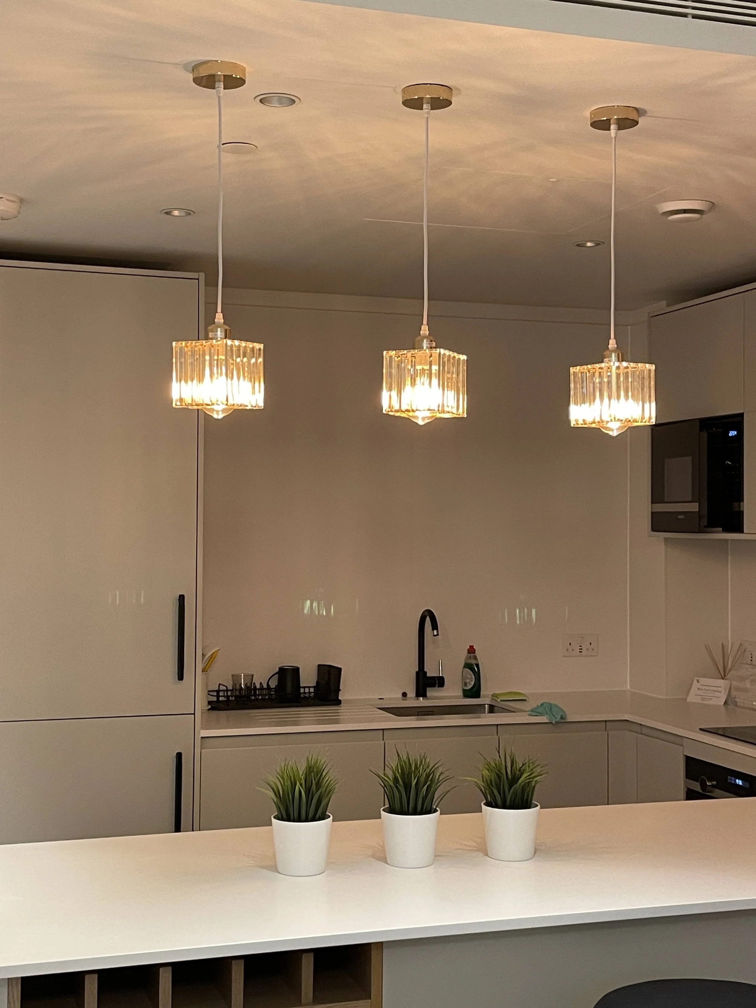 Kitchen pendant lighting detail representing iQ HomeFix home repair and technical installation services