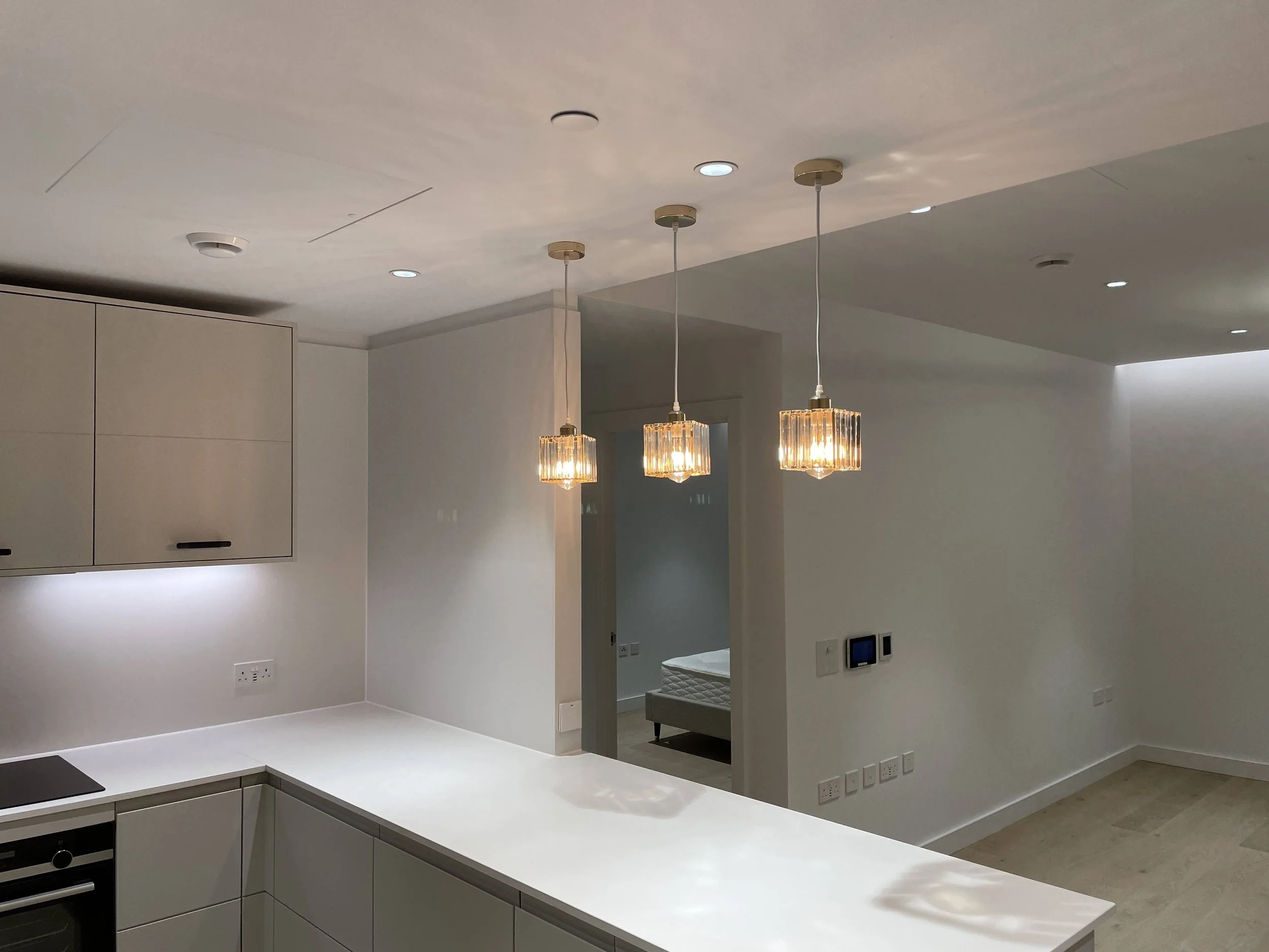 Clean kitchen lighting installation representing iQ HomeFix home repair and technical support