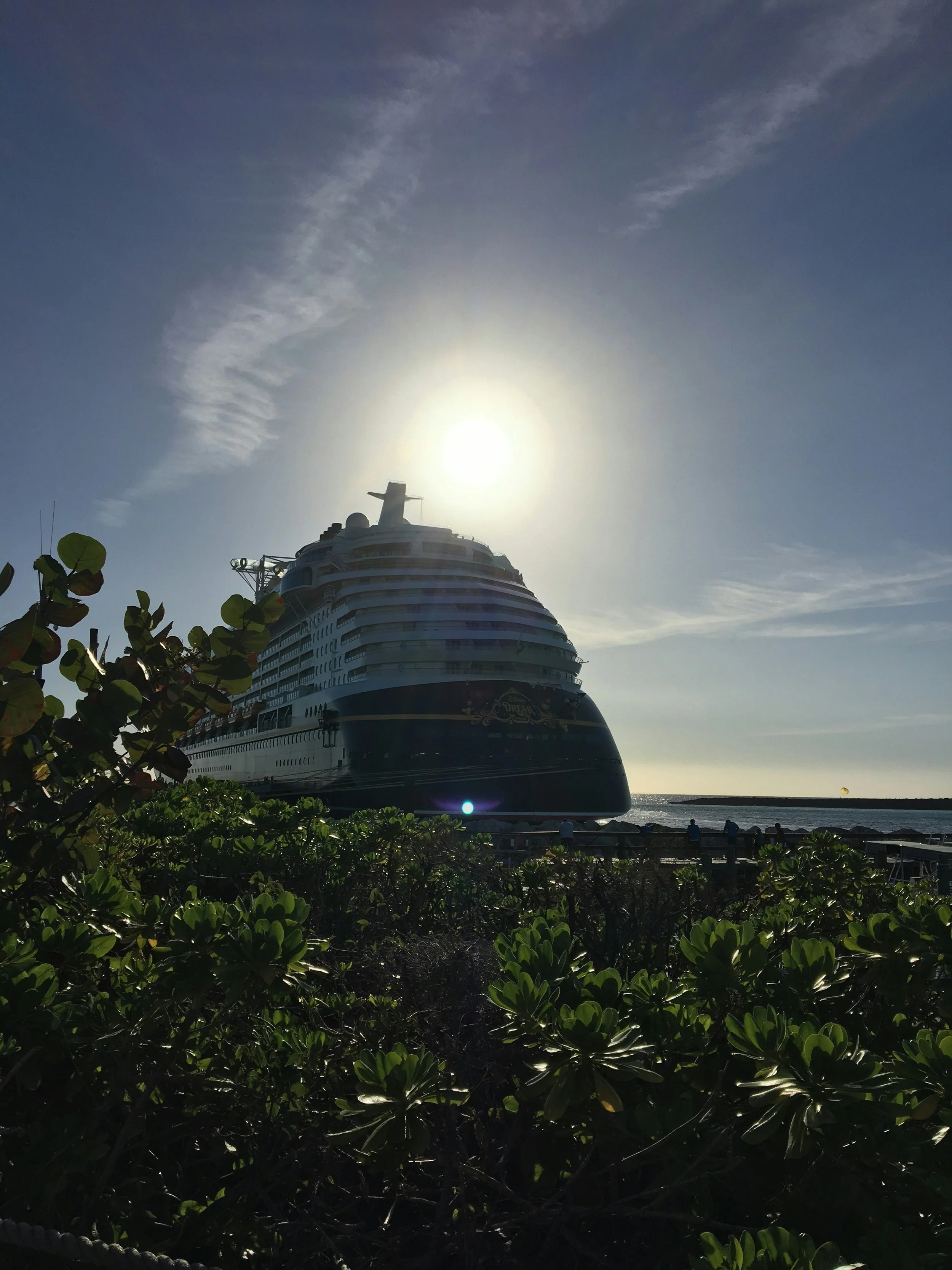 Disney cruise ship with sun in background