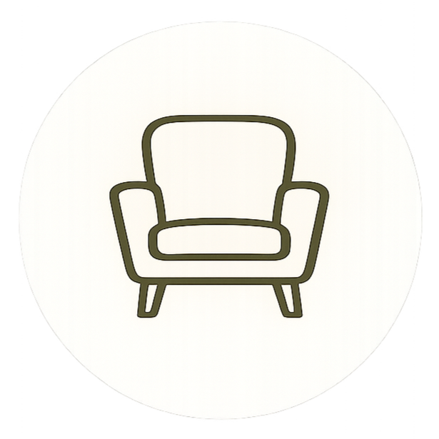 Line drawing of an armchair with a rounded back and angled legs, in a minimalist style.