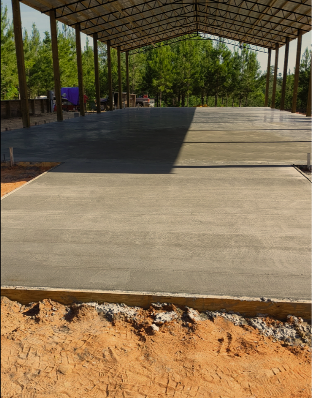Concrete foundation for a pole barn building in rural Oklahoma.
