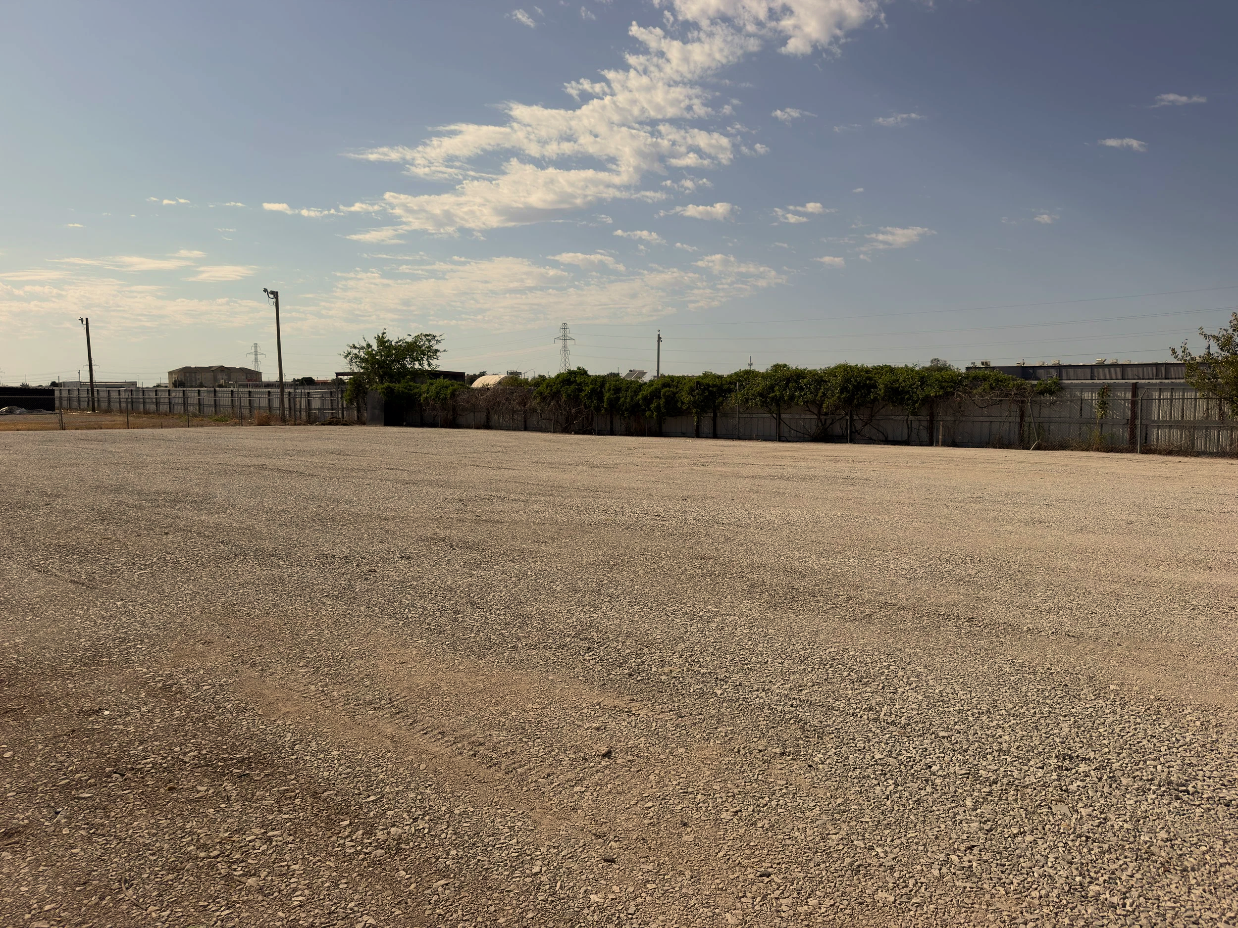 Gravel parking lot refreshed for semi traffic