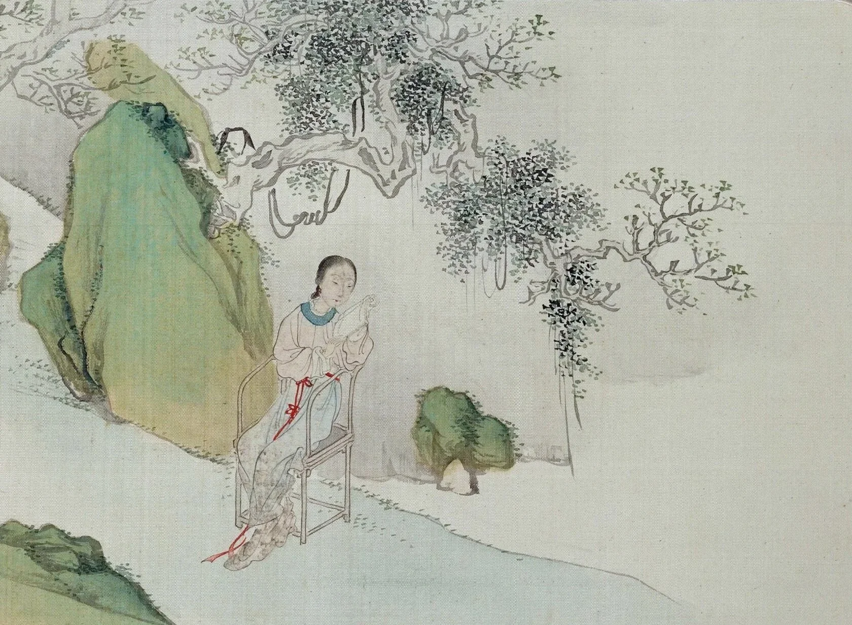 A traditional Chinese painting depicting a woman sitting on a wooden chair, surrounded by trees and rocks in a natural landscape.