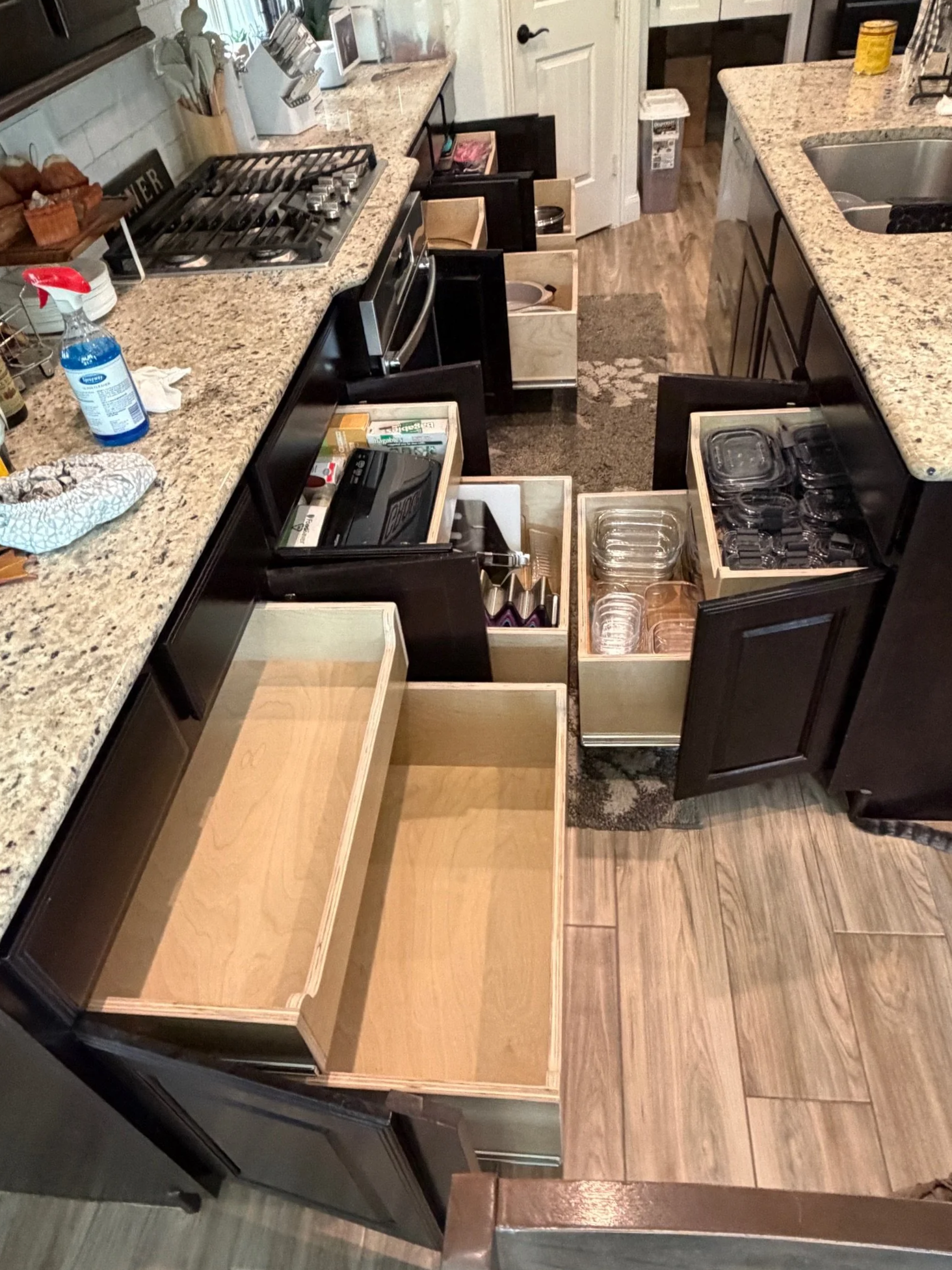 Kitchen with multiple pull out drawers extended.