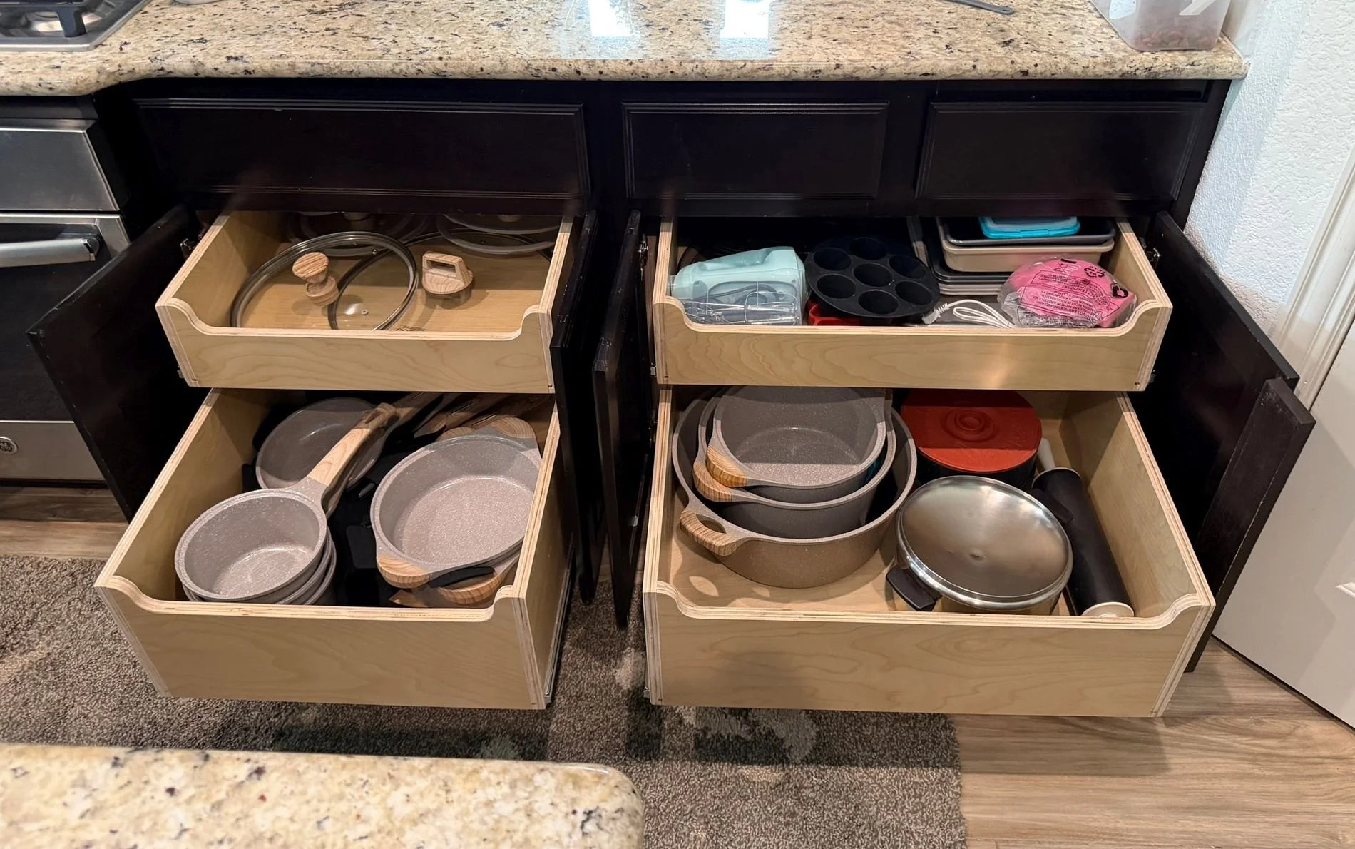 Pull out kitchen drawers with pots and pans.
