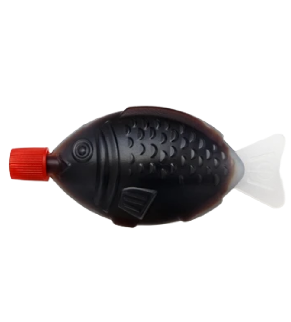 A fish-shaped plastic container with a red screw cap on the fish's head and a white tail, used for dispensing fish-shaped gummy candies or syrup.