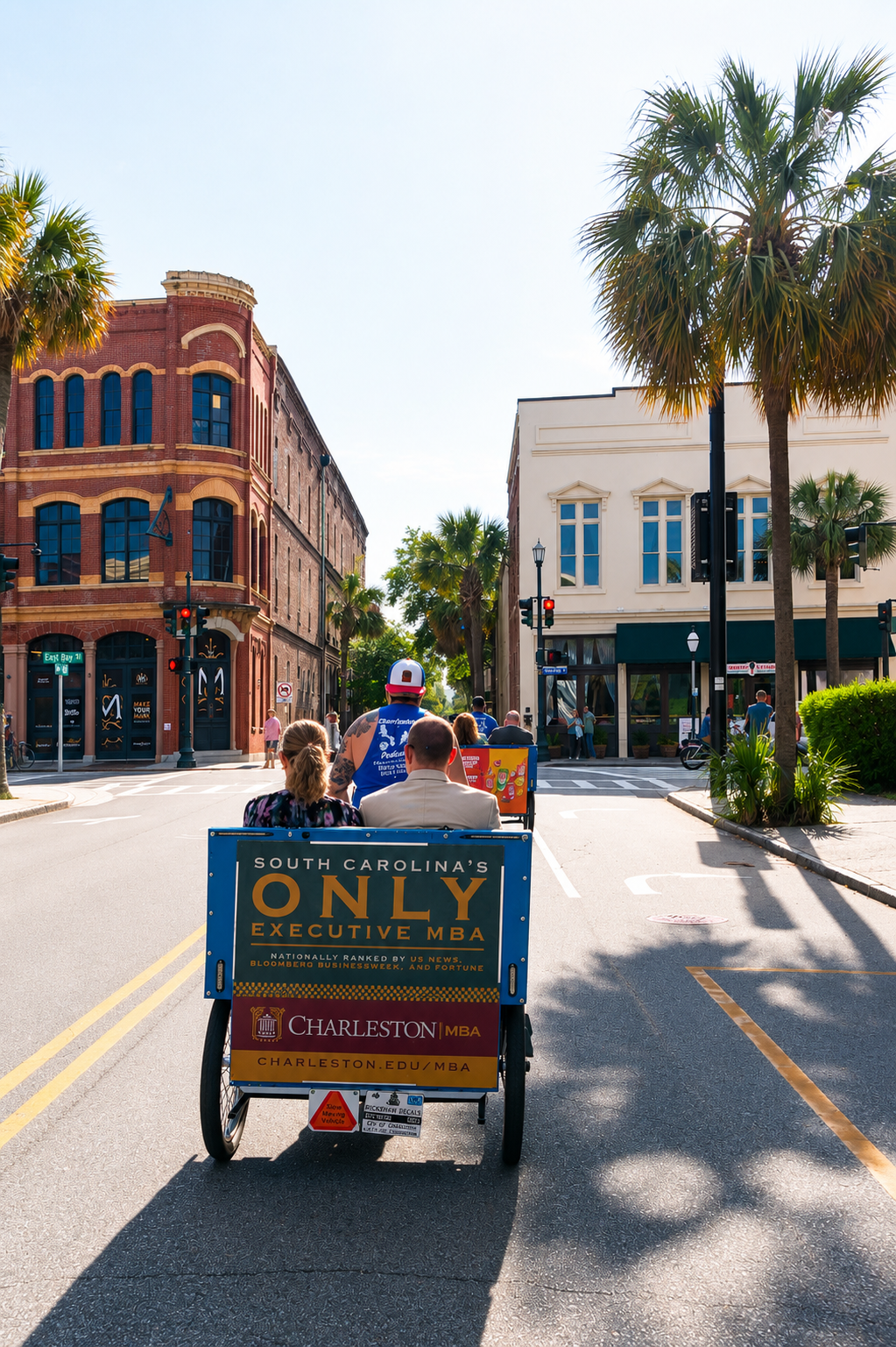A Charleston pedicab with an advertisement rides through a city street lined with palm trees and historic buildings in Charleston, South Carolina.