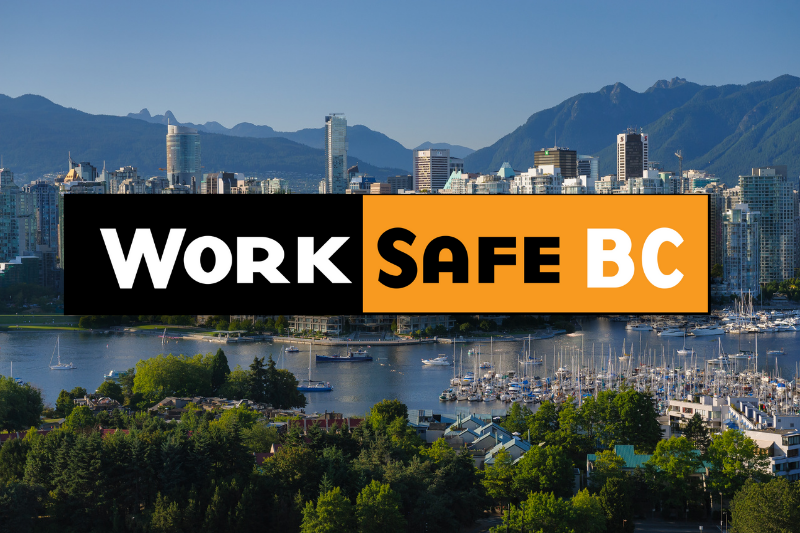 A city skyline with mountains in the background, a marina with boats in the foreground, and a sign that reads 'Work Safe BC' in the center.