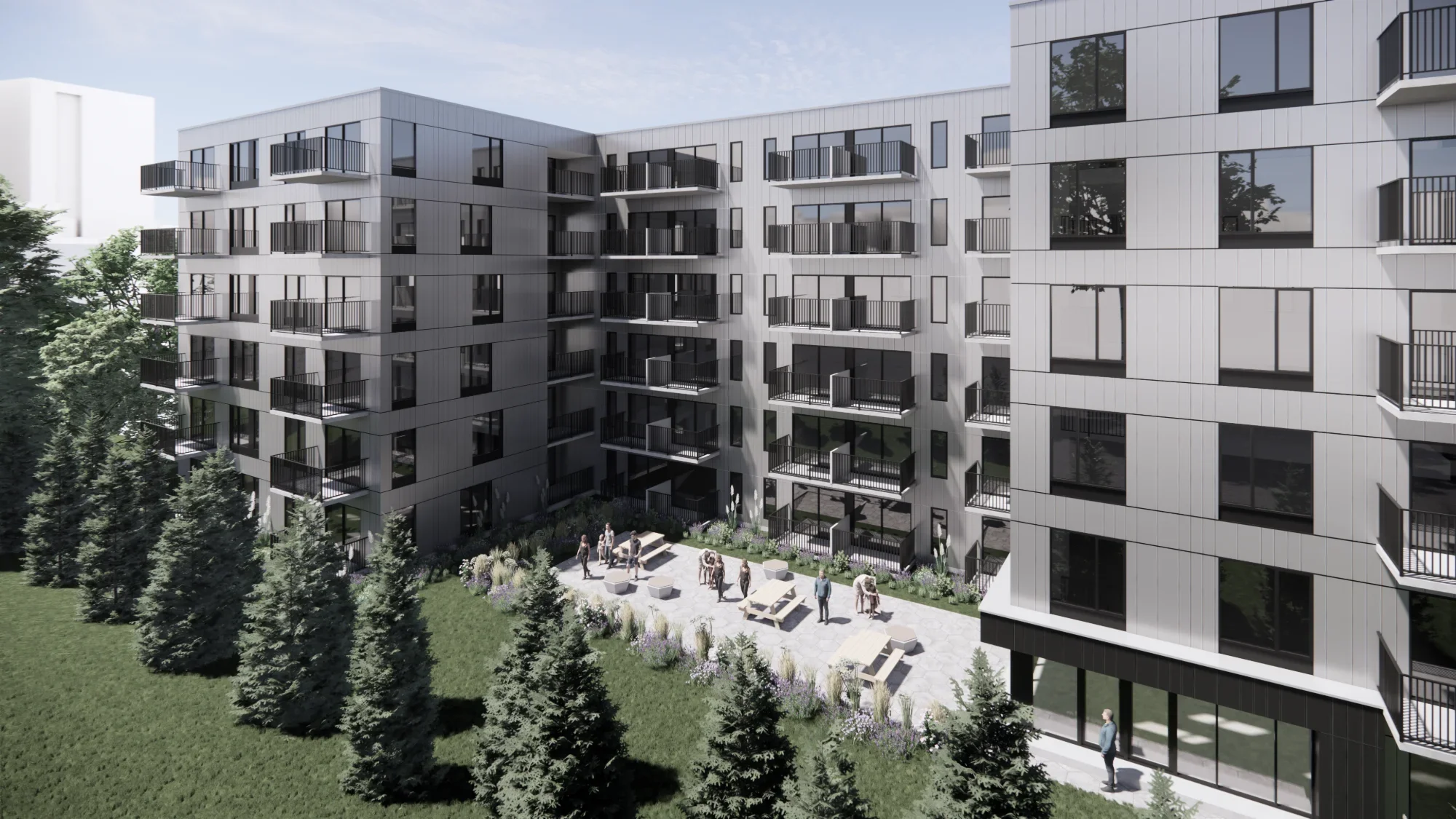 Vue d'un immeuble résidentiel moderne avec plusieurs balcons et un espace vert avec des arbres et des personnes se rassemblant dans une cour extérieure.
