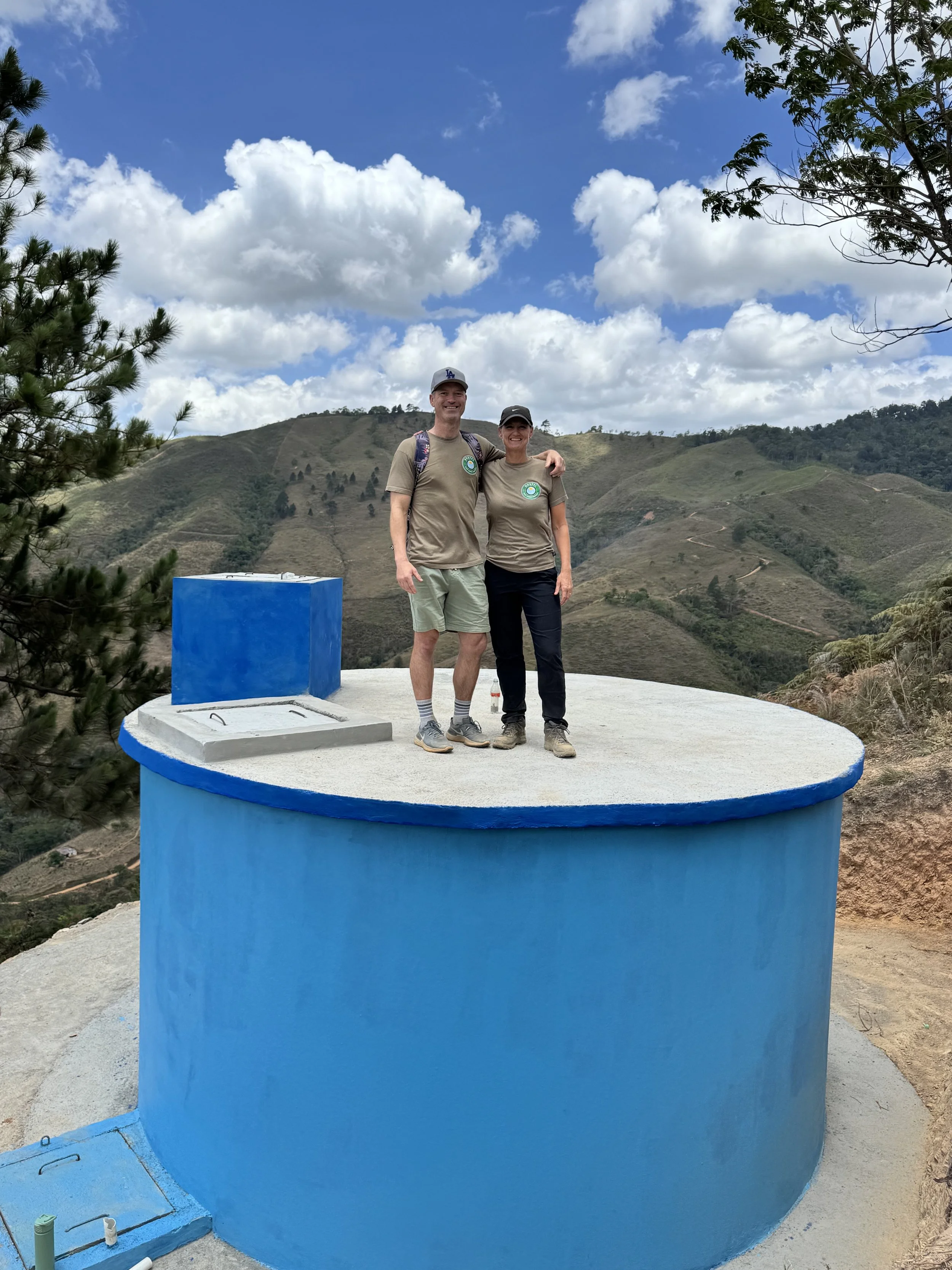 Kyle and Brenda on the new water tank.