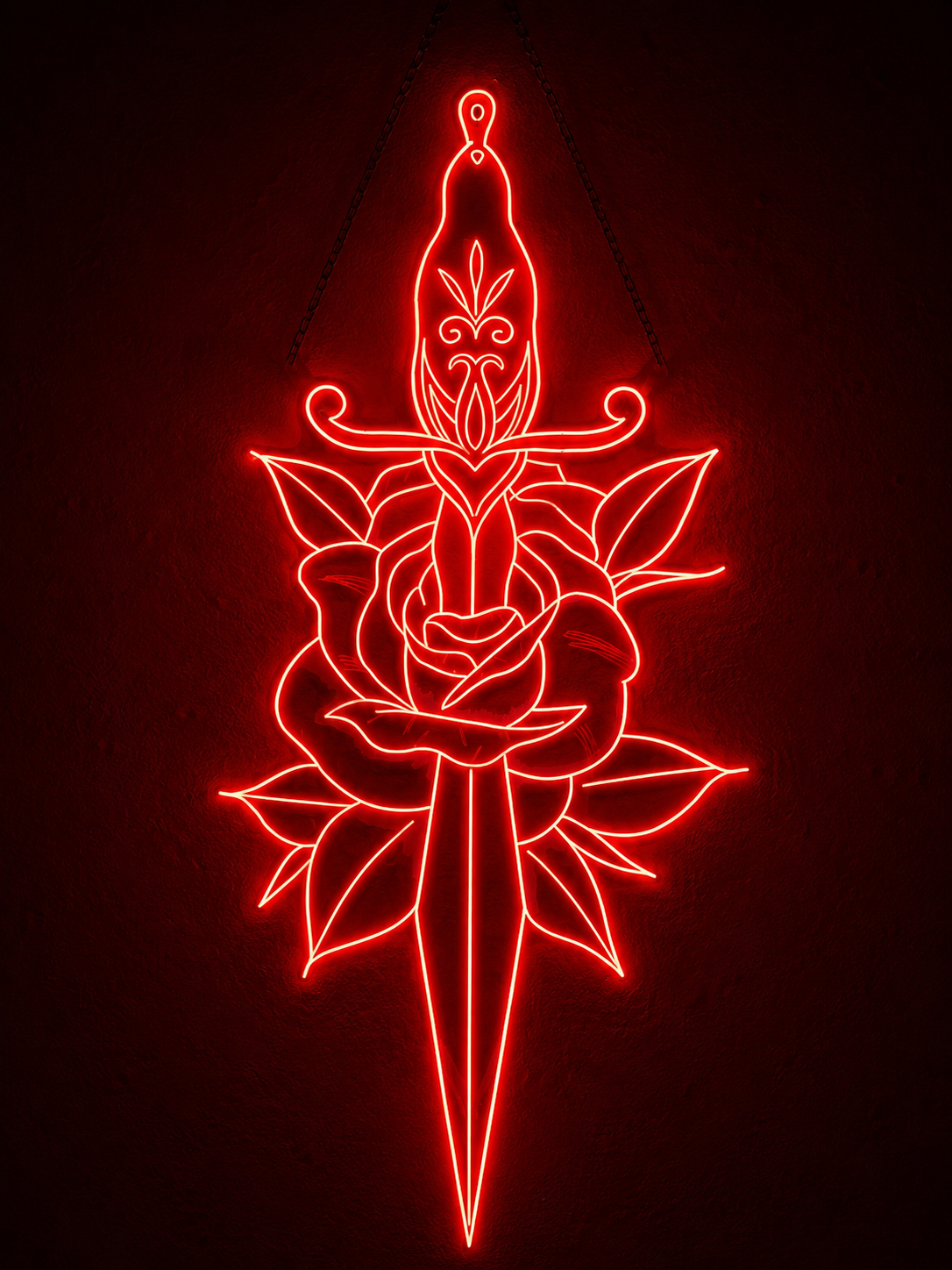 Neon sign of a dagger piercing through a rose, outlined in red lights, hanging on a wall.