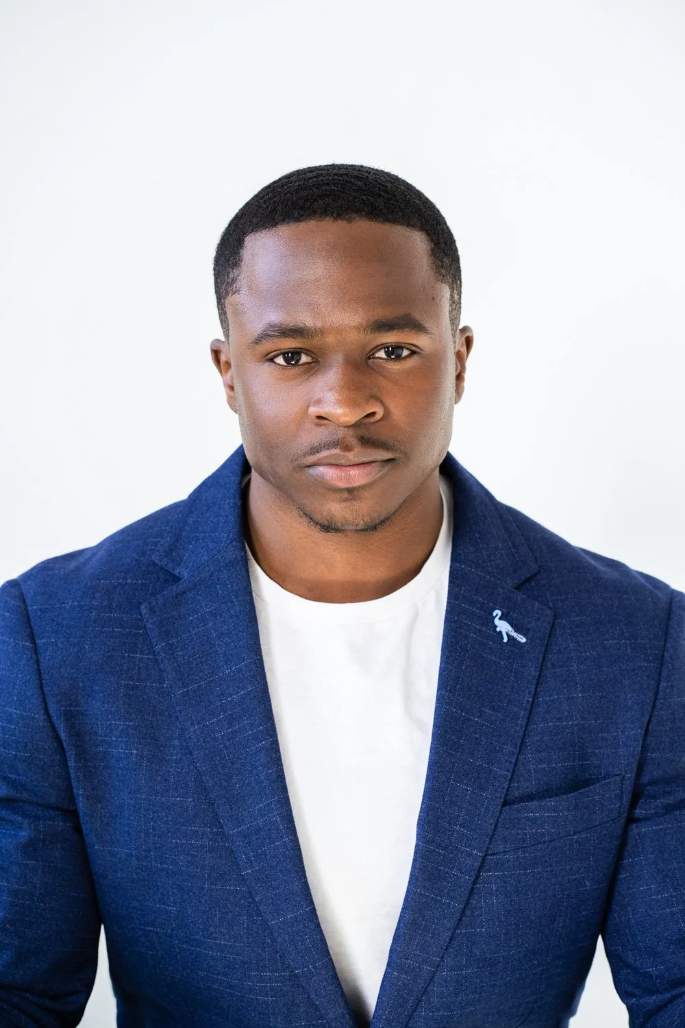headshot of black associate in brooklyn studio