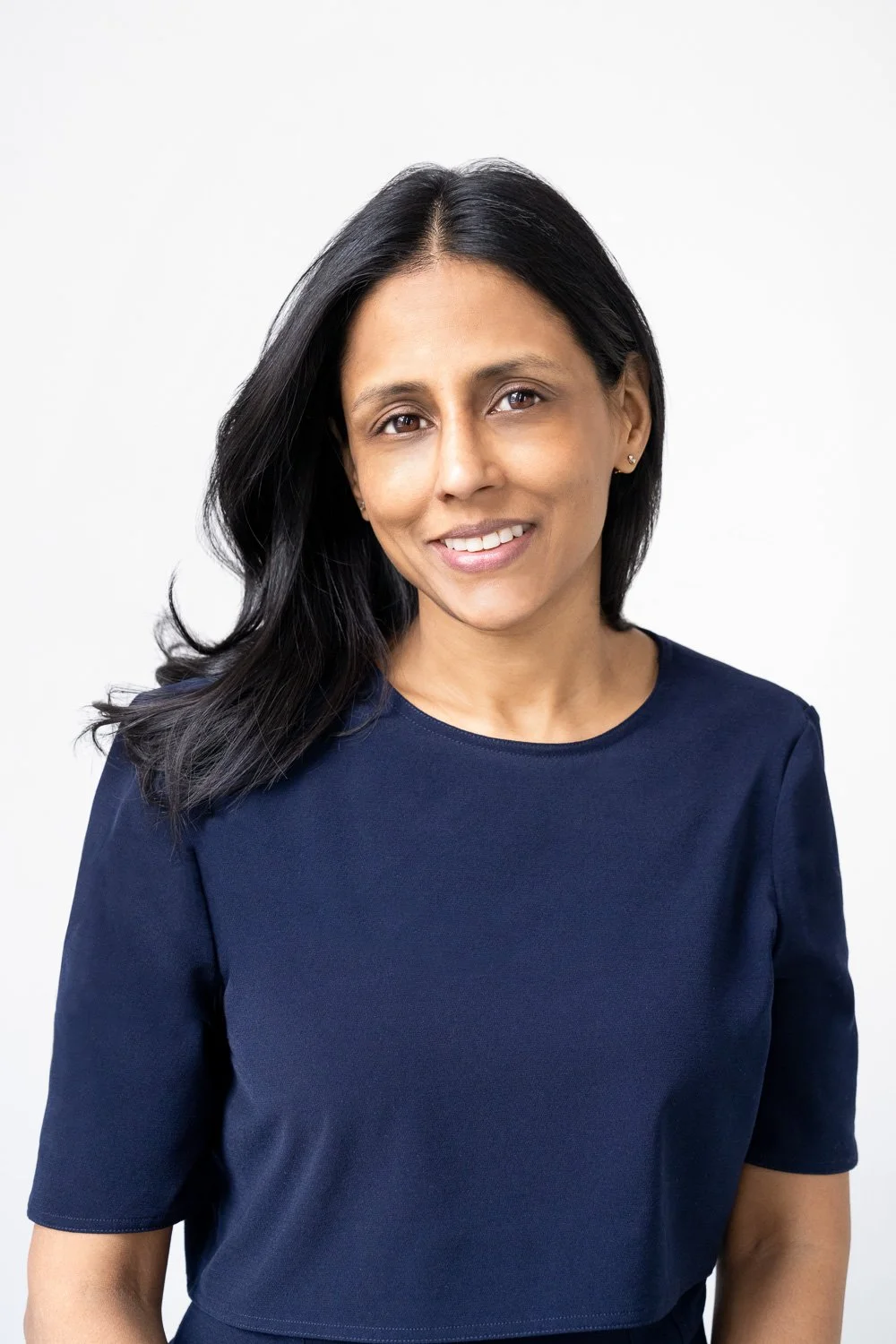 headshot of indian attorney in brooklyn studio