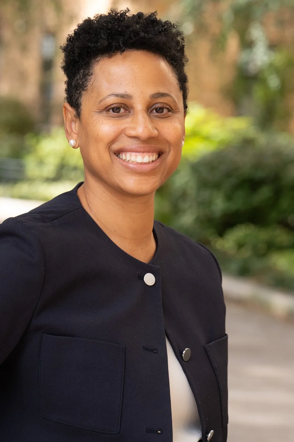 black attorney in exterior headshot in brooklyn