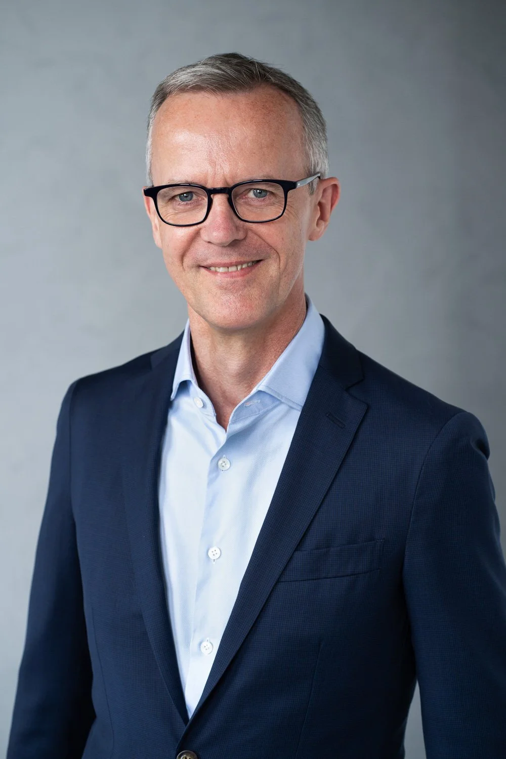 Professional headshot of Chief Technical Officer at big company in Brooklyn studio