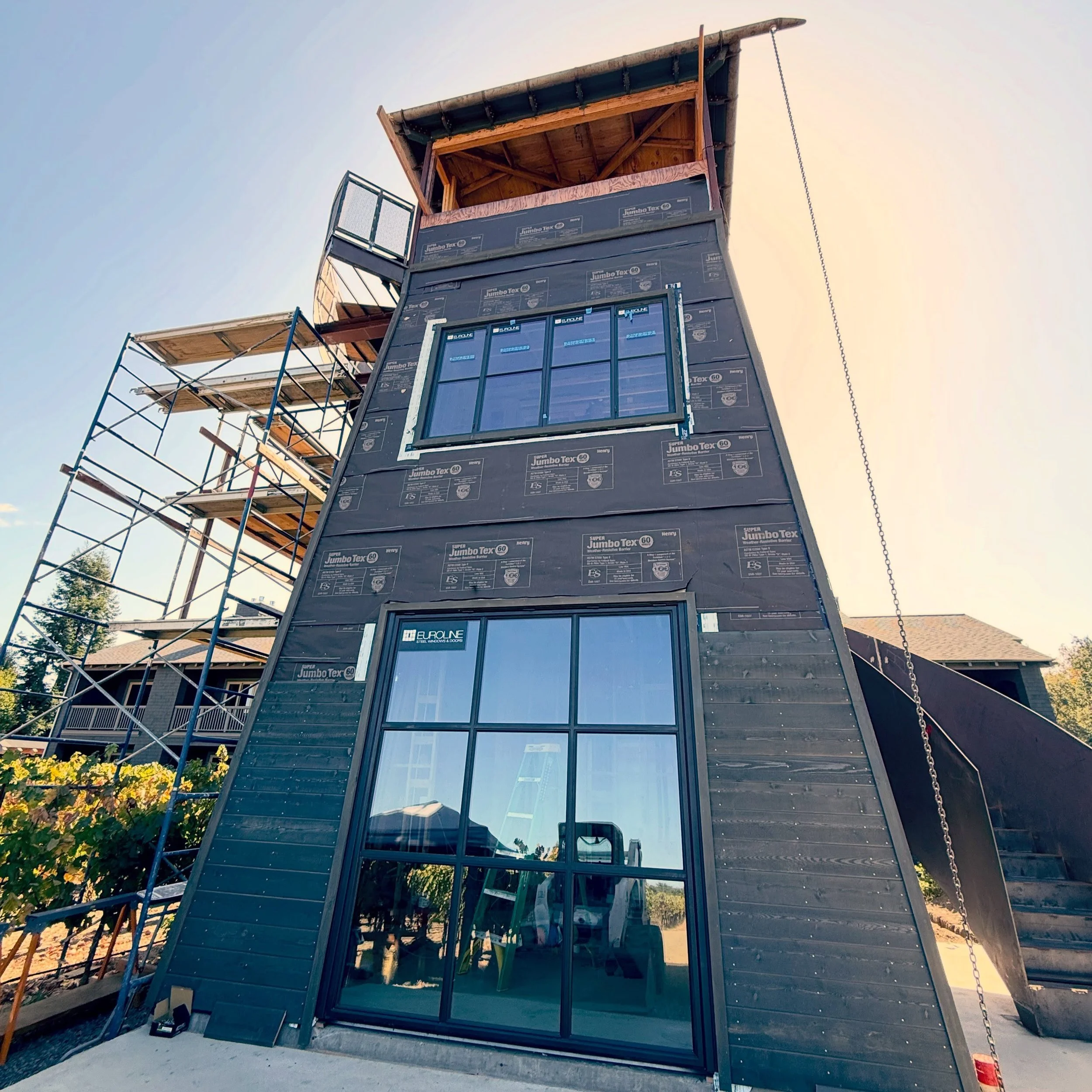 She&rsquo;s coming along.  One of the marquis features are the @eurolinesteelwindows and the big garage door that opens into the vineyard.  Counting the days until we get to experience these beautuful views!