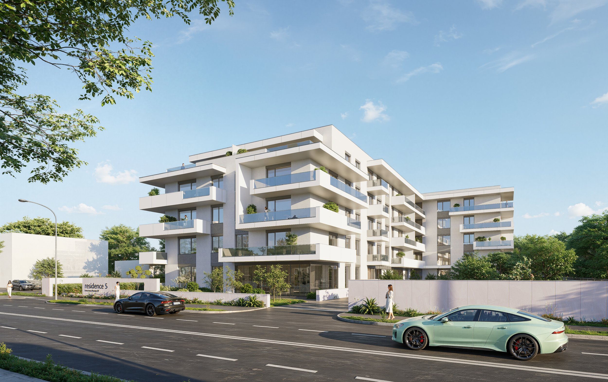 Modern white apartment building with multiple balconies surrounded by green trees, cars parked on the street, and people walking near the building.