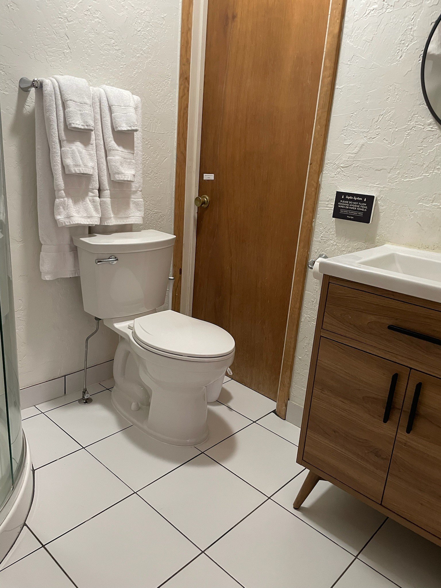 Updated bathroom in each motel room of the historic spruce lodge accommodations.