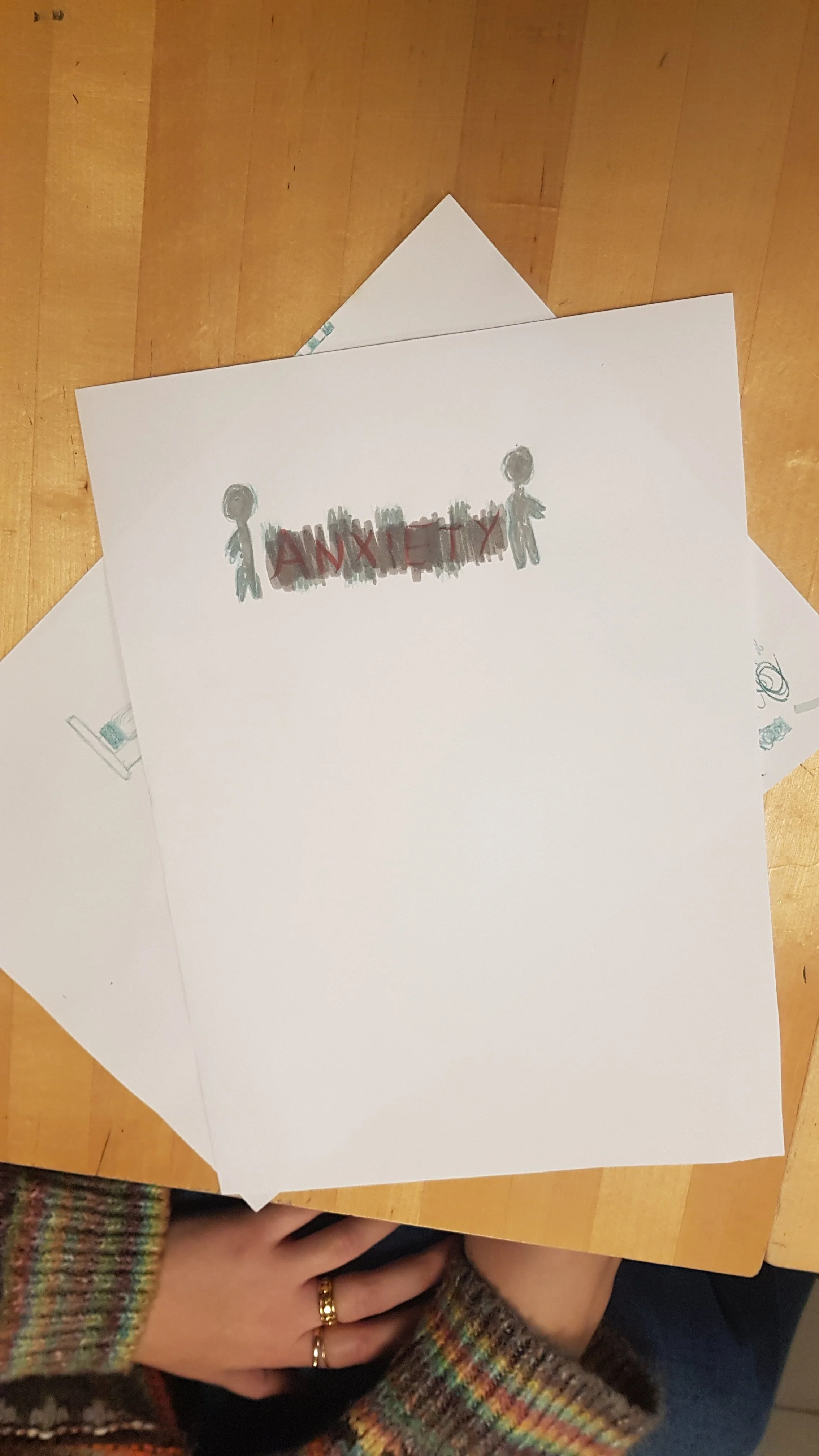 Drawing of two people with the word 'ANXIETY' written between them.