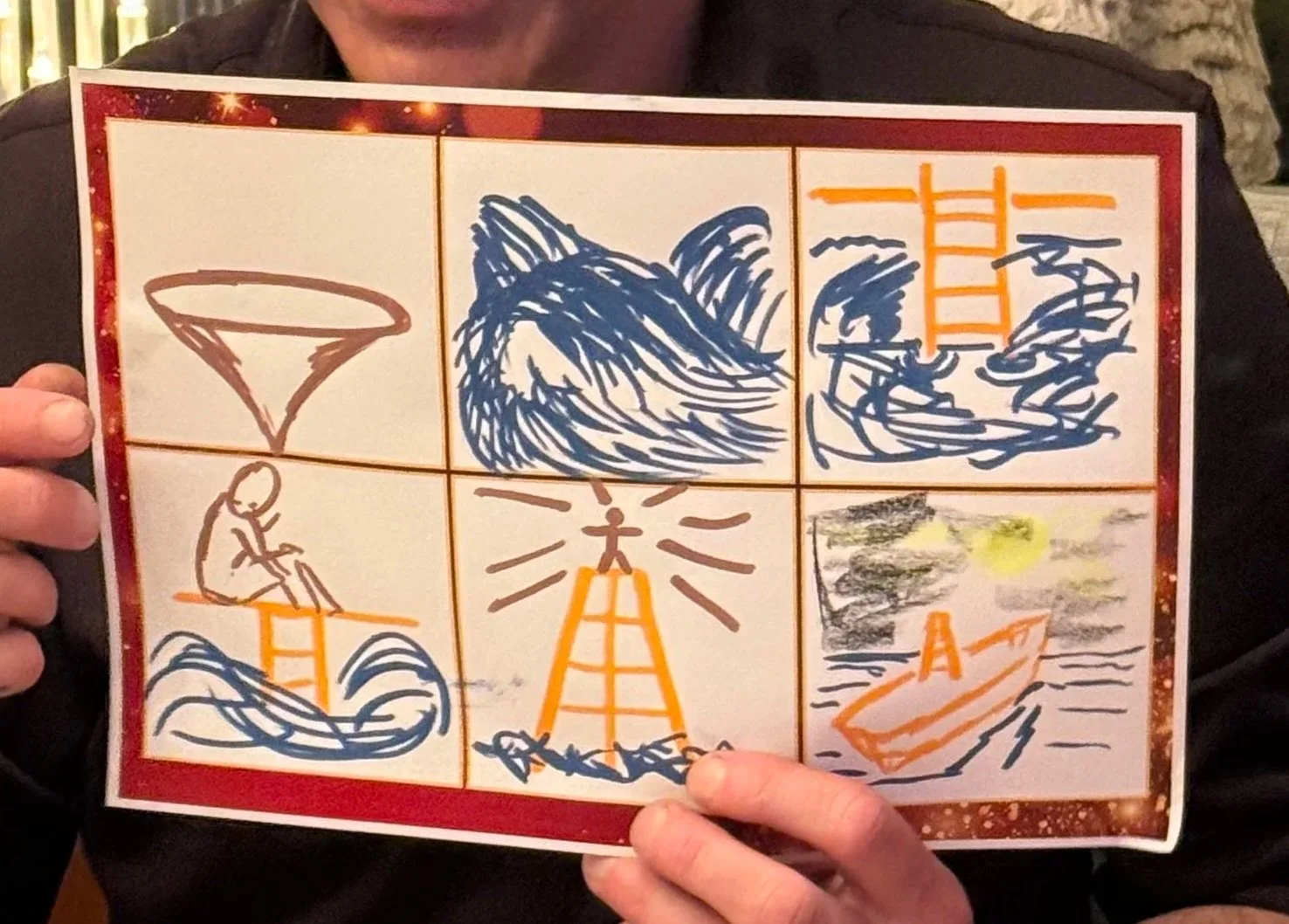 A person holding a drawing with six panels that depict a tornado, a wave, a lighthouse, a person sitting on a wave, a lighthouse with light rays, and a boat on the water.