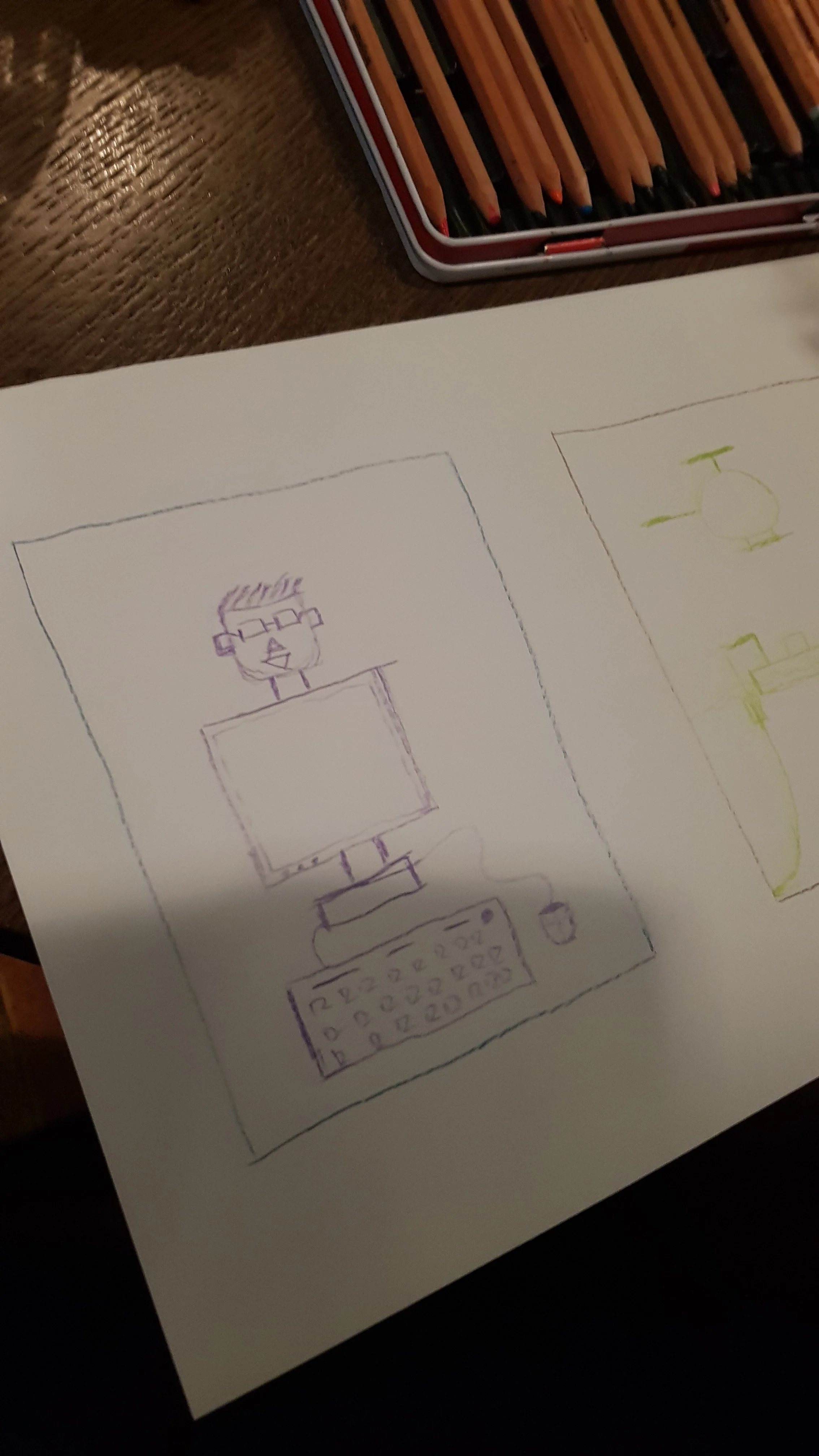 Hand-drawn sketches of a computer setup and a drone on a sheet of paper, placed on a dark wooden table.
