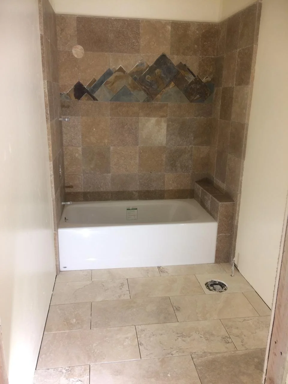 custom_tub_tile_surround_with_mountain_accent_south_lake_tahoe.jpeg