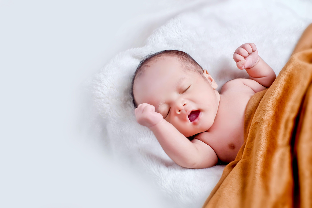 Infant yawning, representing a certified copy of a San Mateo County birth certificate