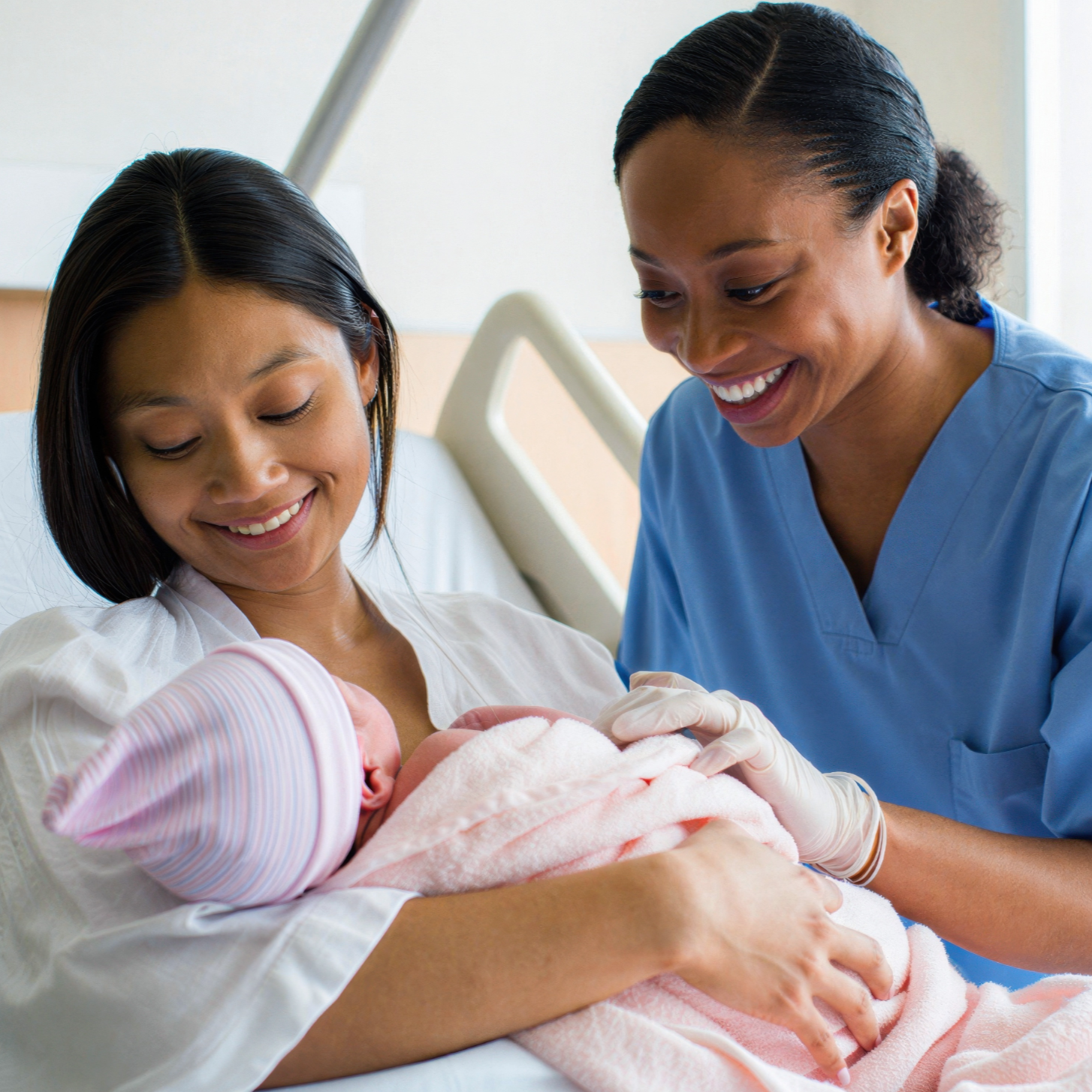 Mother and nurse smiling at newborn, representing a link to the Birth Certificate Apostille page