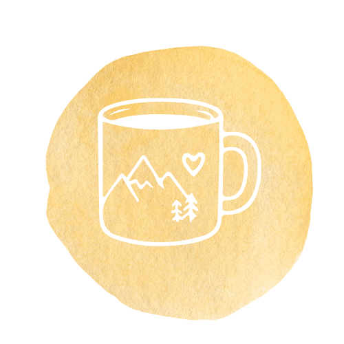 White line drawing of a mug with mountain peaks, a heart, and pine trees inside, on a textured yellow circular background.