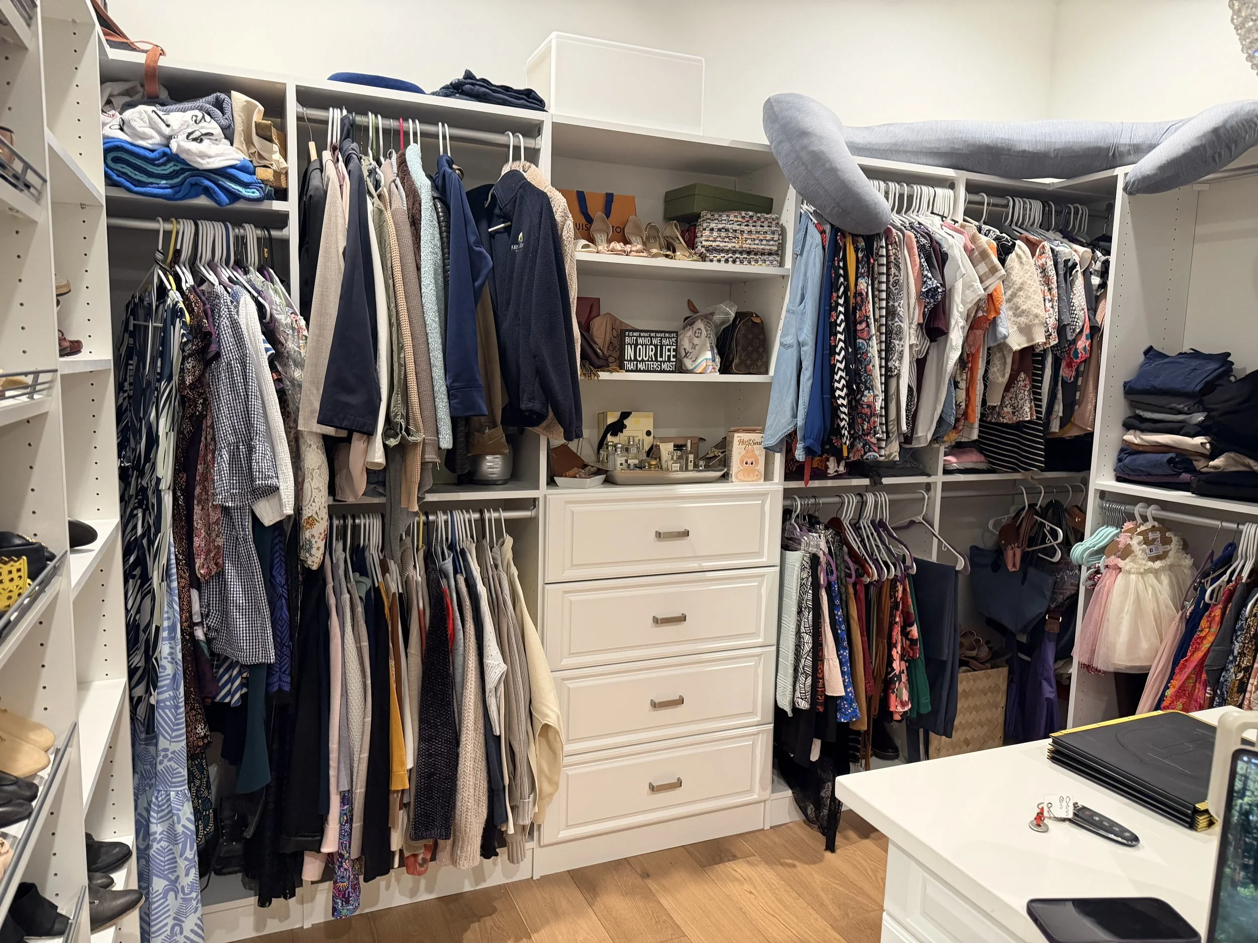 Before and after closet organization for a Tampa homeowner, showing clothing, shoes, handbags, and folded items arranged to maximize storage space.
