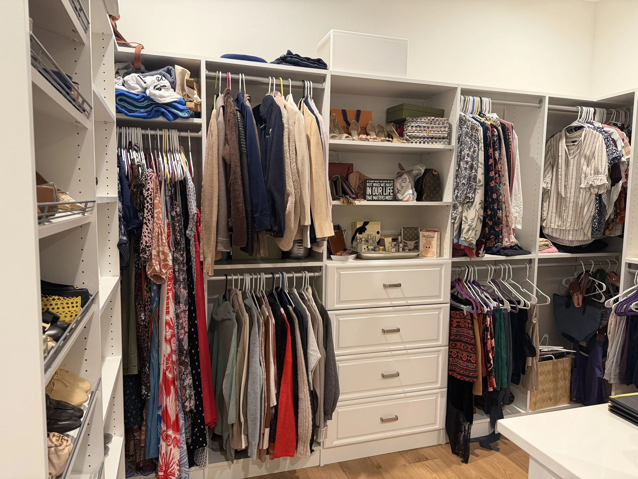 Luxury closet organization project in Tampa with shelves, drawers, hanging clothes, shoes, and accessories arranged to reduce clutter and improve storage.